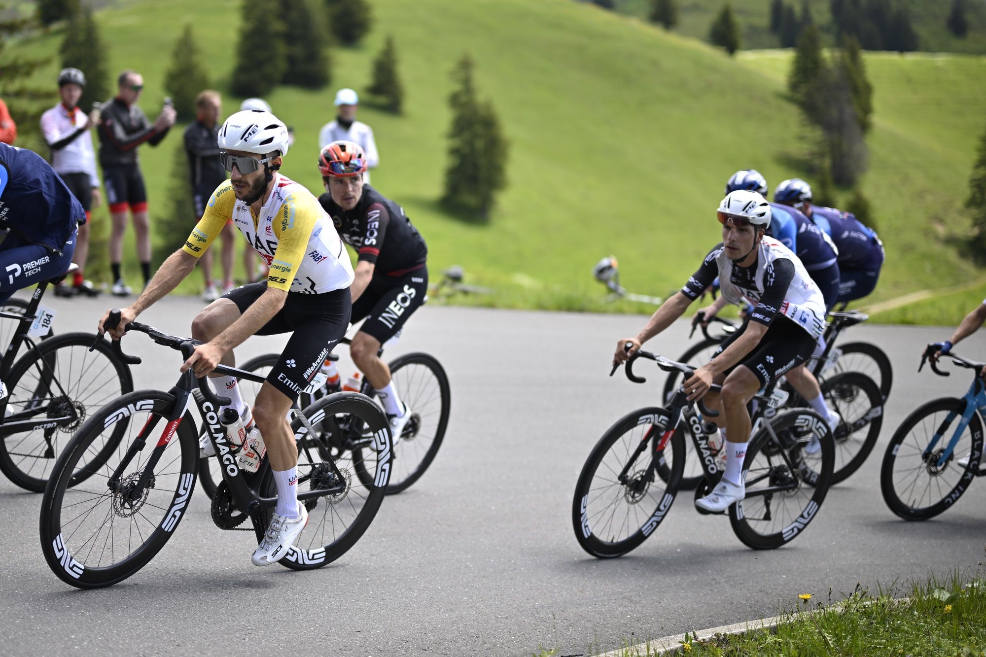 epa11412081 Adam Yates (L) from  Britain of UAE Team Emirates and Joao Almeida from Portugal of UAE Team Emirates in action during the seventh stage, a 118.1 km race, at the 87th Tour de Suisse UCI World Tour cycling race, in Villars-Sur-Ollon, Switzerland, 15 June 2024.  EPA/GIAN EHRENZELLER