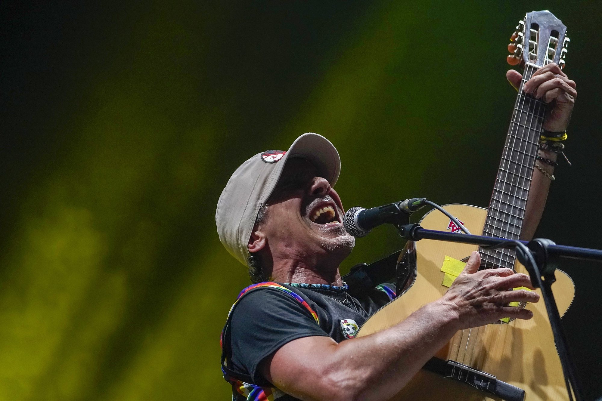 epa11414144 French musician and composer Manu Chao performs on stage in Mieres, northern Spain, 15 June 2024.  EPA/PACO PAREDES