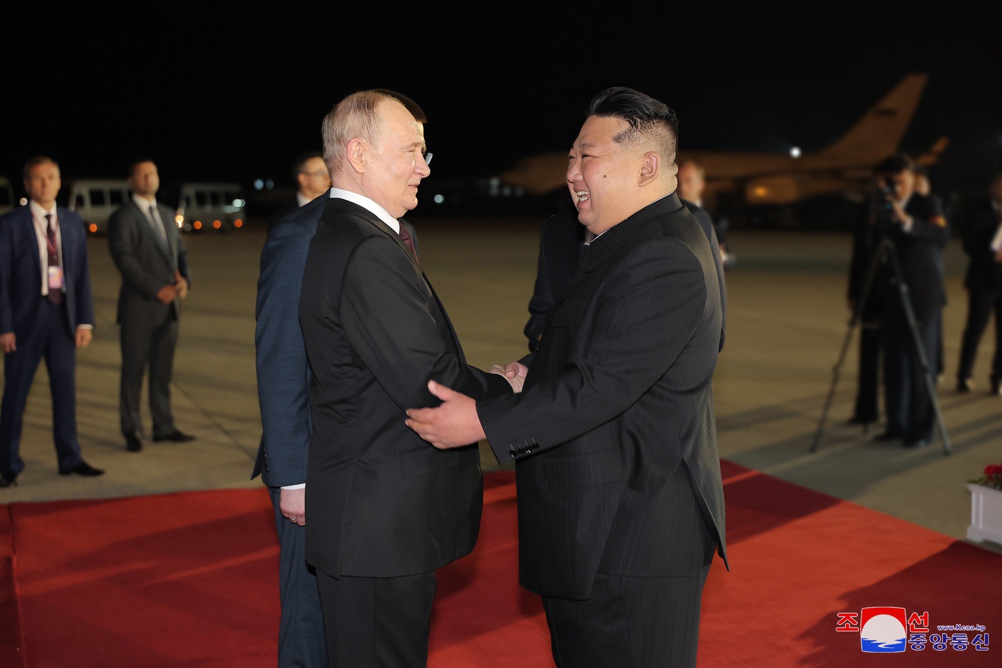 epa11421416 A photo released by the official North Korean Central News Agency (KCNA) shows Russian President Vladimir Putin (L) received by North Korean leader Kim Jong Un upon arrival at the airport of Pyongyang, North Korea, 18 June 2024 (issued 19 June 2024). The Russian president is on a state visit to North Korea from 18-19 June at the invitation of the North Korean leader. He last visited North Korea in 2000, shortly after his first inauguration as president.  EPA/KCNA   EDITORIAL USE ONLY  EDITORIAL USE ONLY