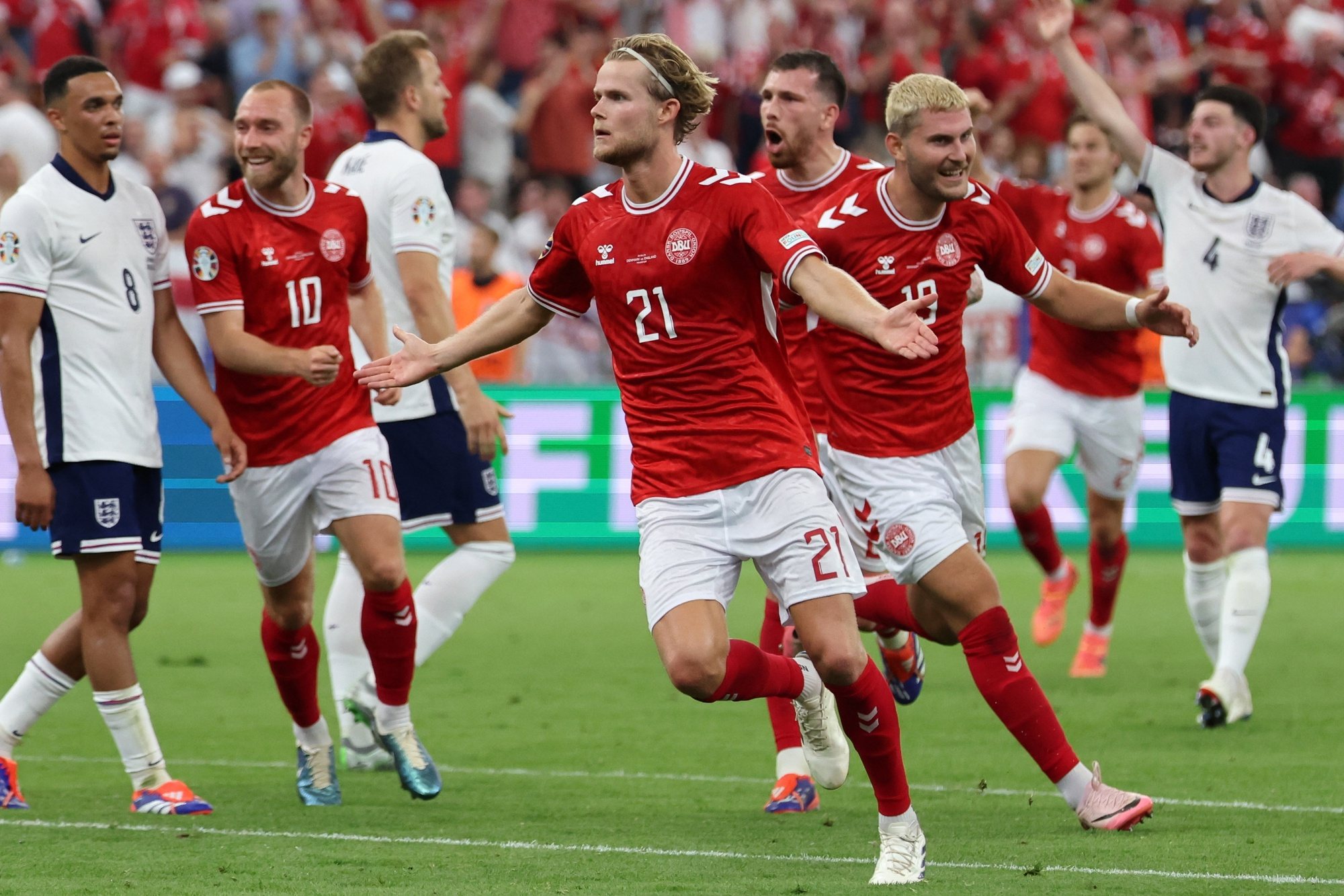epa11426003 Morten Hjulmand of Denmark celebrates scoring the 1-1 goal during the UEFA EURO 2024 group C match between Denmark and England, in Frankfurt Main, Germany, 20 June 2024.  EPA/ABEDIN TAHERKENAREH