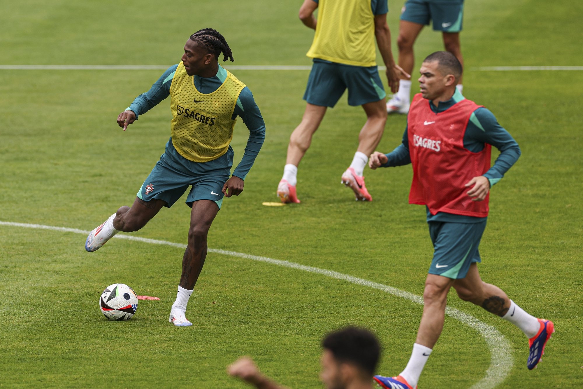 Portugal national soccer team players Rafael Leão (L) and Pepe (R) during a training session open to the public at Heidewaldstadion in Gütersloh, Germany, 14 June 2024. The Portuguese national soccer team is based in Marienfeld, Harsewinkel during the UEFA EURO 2024. MIGUEL A. LOPES/LUSA