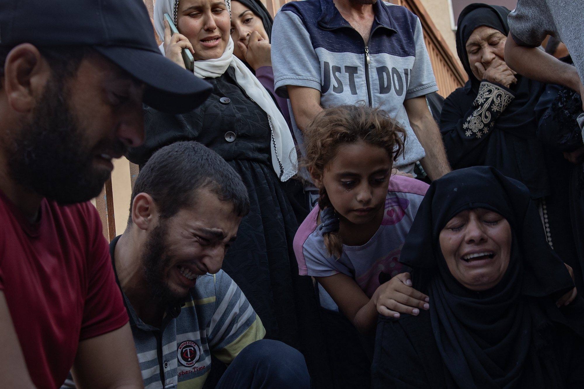 epa11429128 Palestinian families mourn next to the bodies of their relatives who were killed in an Israeli military strike that targeted a camp in the Al-Mawasi area, at Nasser Hospital in the Gaza Strip, 21 June 2024. More than 37,000 Palestinians and over 1,400 Israelis have been killed, according to the Palestinian Health Ministry and the Israel Defense Forces (IDF), since Hamas militants launched an attack against Israel from the Gaza Strip on 07 October 2023, and the Israeli operations in Gaza and the West Bank which followed it.  EPA/HAITHAM IMAD