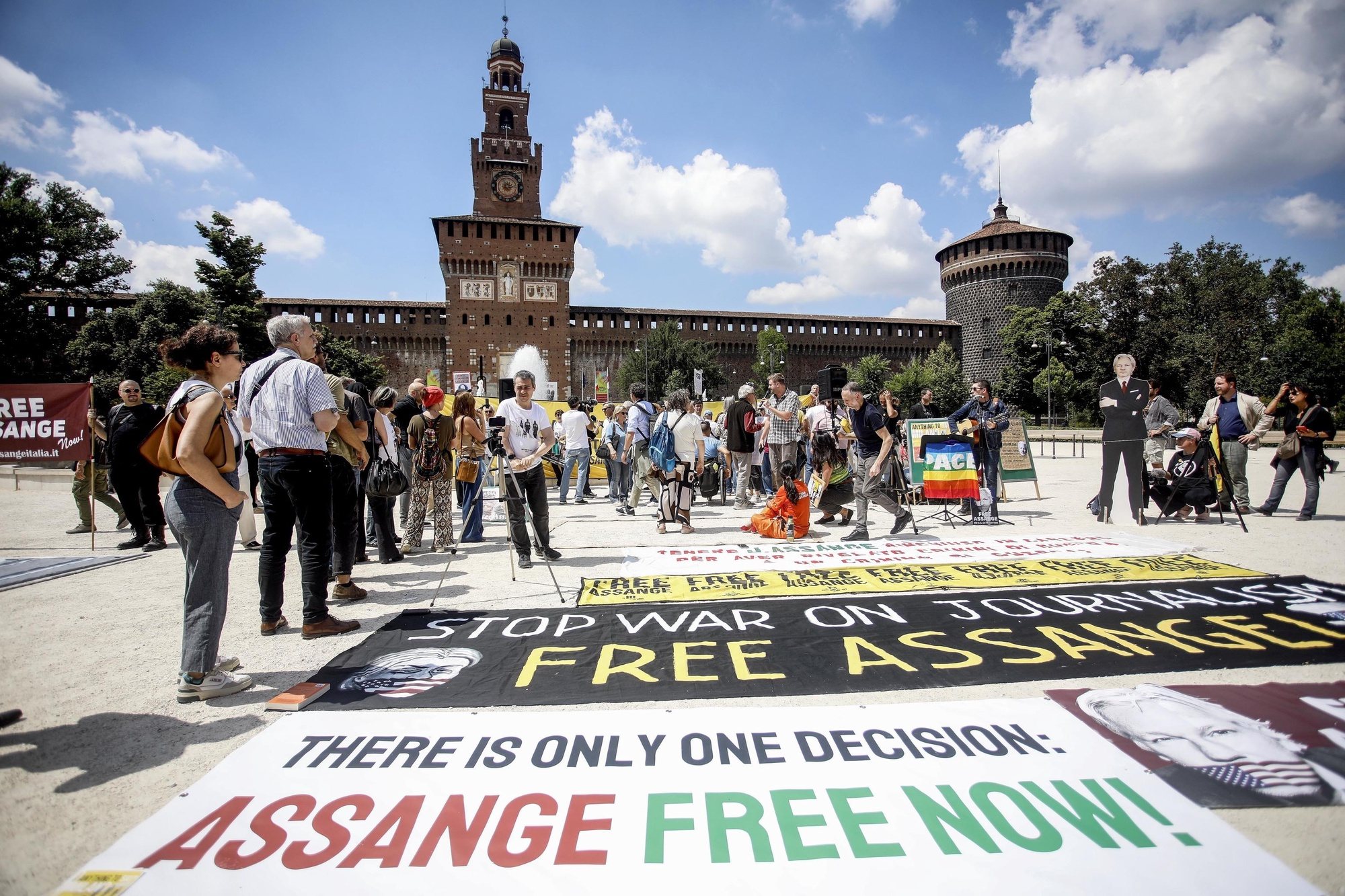epa11415592 People gather during a protest in support of Julian Assange, co-founder of WikiLeaks, at the Castello square, in Milan, Italy, 16 June 2024. Assange is currently being held in a maximum security prison in London amid a legal battle to avoid extradition to the United States.  EPA/Mourad Balti Touati