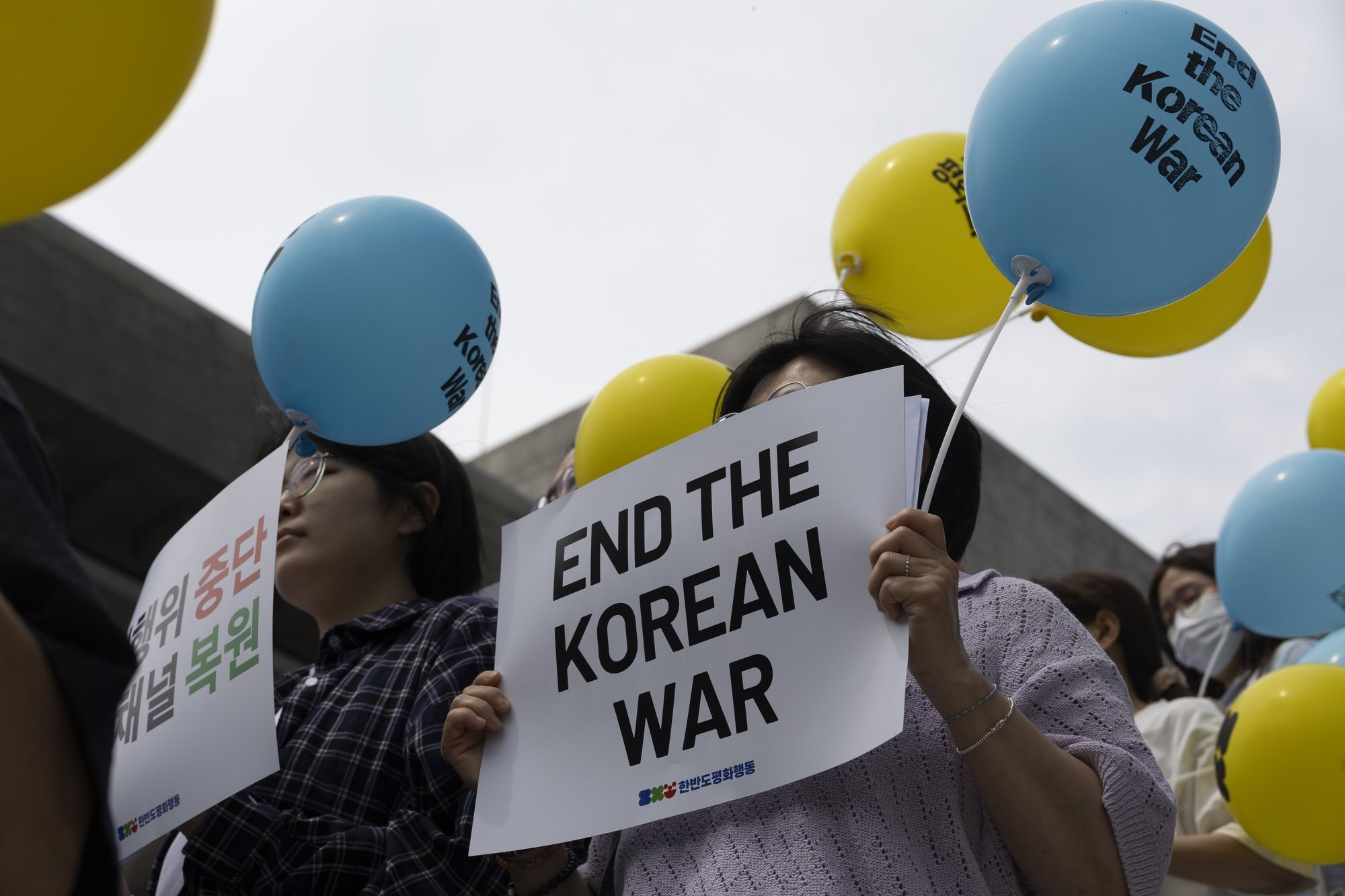 epa11435744 Members of the Kora Peace Action, hold up signs reading &quot;No War, Yes Peace&quot; during a rally against policy toward North Korea while South Korea marks the 74th anniversary of the Korean War in Seoul, South Korea, 25 June 2024. Protesters gathered to demand the restoration of the inter-Korean military agreement and inter-Korean dialogue channels and improved relations.  EPA/JEON HEON-KYUN