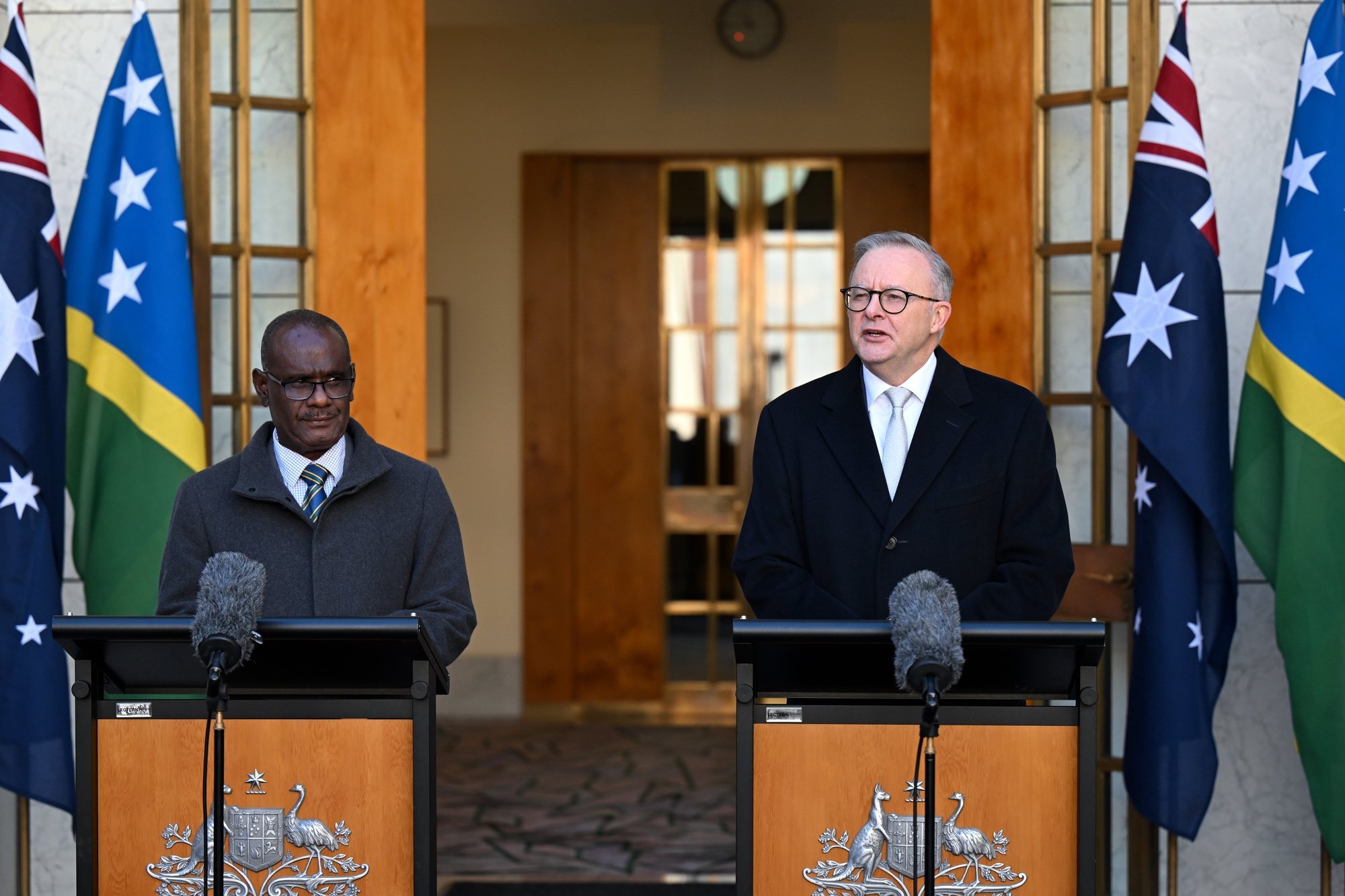 epa11438206 Solomon Islands Prime Minister Jeremiah Manele (L) and Australian Prime Minister Anthony Albanese speak to the media during a press conference at the Australian Parliament House in Canberra, Australia, 26 June 2024.  EPA/LUKAS COCH AUSTRALIA AND NEW ZEALAND OUT