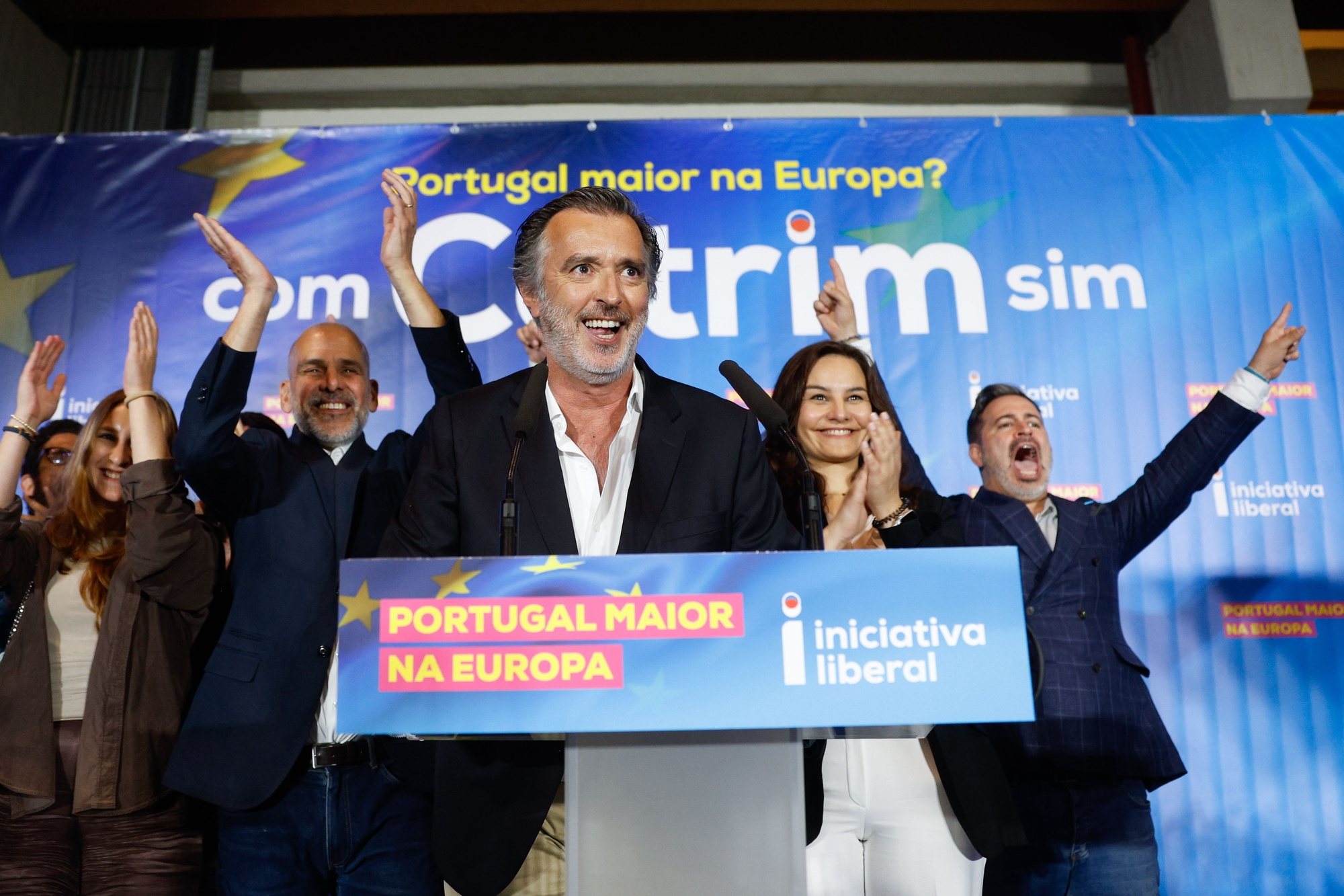 epa11401359 The candidate of the Iniciativa Liberal (IL) party Joao Cotrim de Figueiredo (C) reacts at the party electoral headquarters after knowing the results of the European elections night in Lisbon, Portugal, 09 June 2024. More than 10.8 million registered voters in Portugal and abroad went to the polls to choose 21 of the 720 members of the European Parliament.  EPA/ANTONIO PEDRO SANTOS