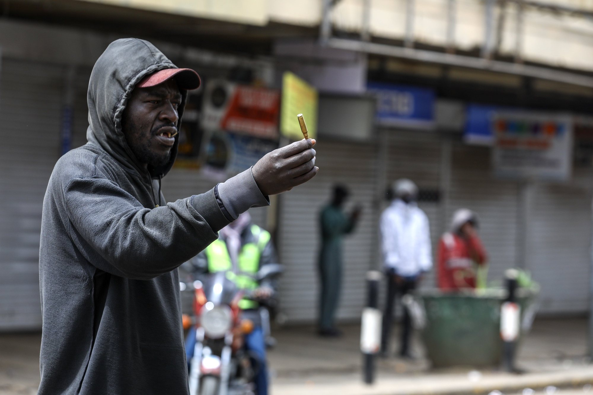 epa11441121 A man holds an empty ammunition shell during a renewed protest two days after deadly protests against tax hikes in Nairobi, Kenya, 27 June 2024. Kenyan President William Ruto said on 26 June that he wouldn&#039;t sign into law a finance bill proposing new tax hikes, a day after protesters stormed the parliament and several people were shot dead. At least 22 people have lost their lives in protests against tax hikes since 25 June 2024, according to Kenya National Human Rights Commission.  EPA/DANIEL IRUNGU