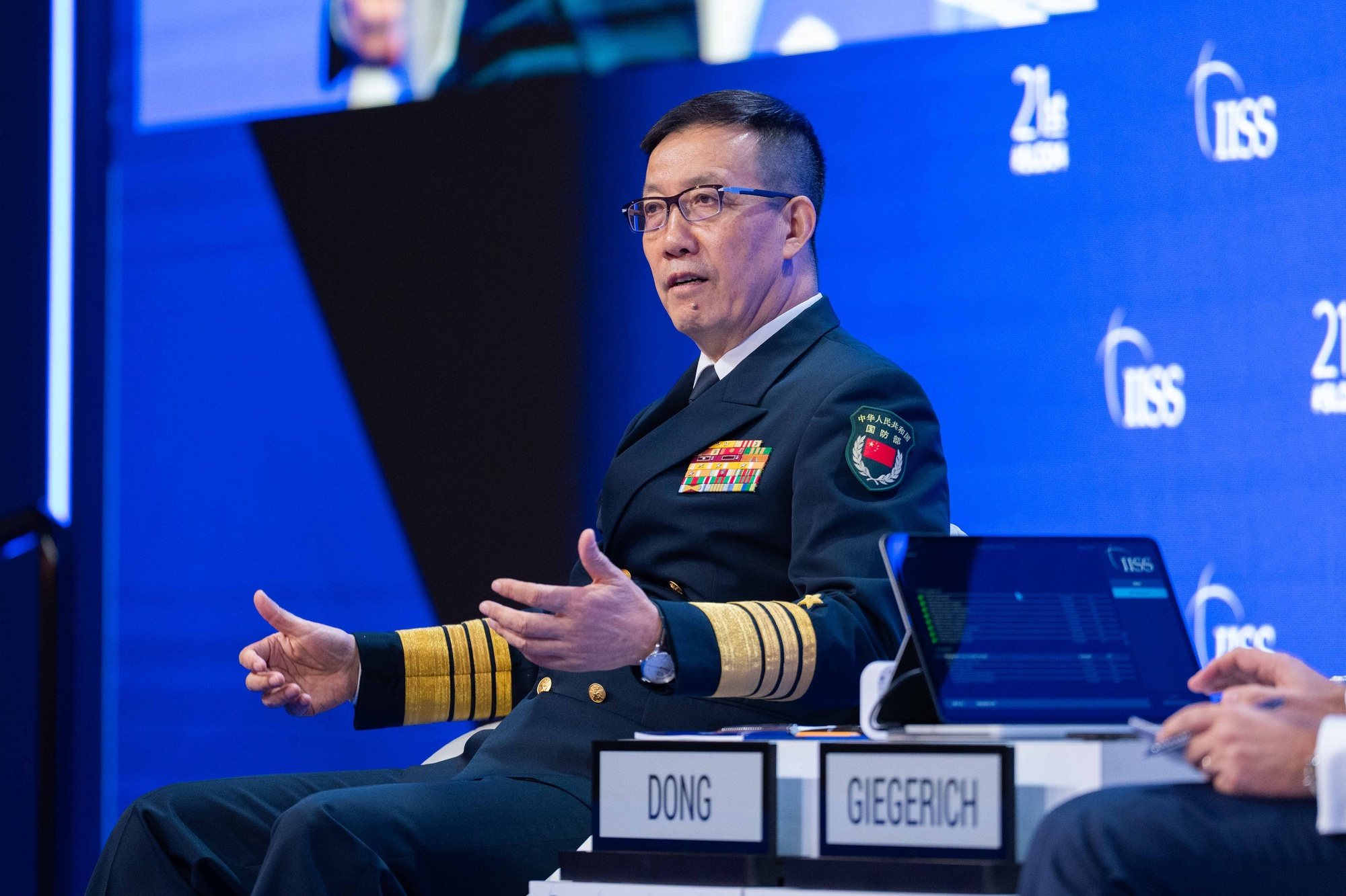 epa11385017 A handout photo made available by the International Institute for Strategic Studies (IISS) shows China&#039;s Minister of National Defence Admiral Dong Jun delivering his speech during a plenary session of the International Institute for Strategic Studies (IISS) 21th Shangri-La Dialogue in Singapore, 02 June 2024. Defense ministers and officials from 45 countries are gathered in the city state for the IISS Shangri-la Dialogue, an annual high level defence summit in the Asia Pacific region.  EPA/International Institute for Strategic Studies (IISS)   HANDOUT EDITORIAL USE ONLY/NO SALES HANDOUT EDITORIAL USE ONLY/NO SALES