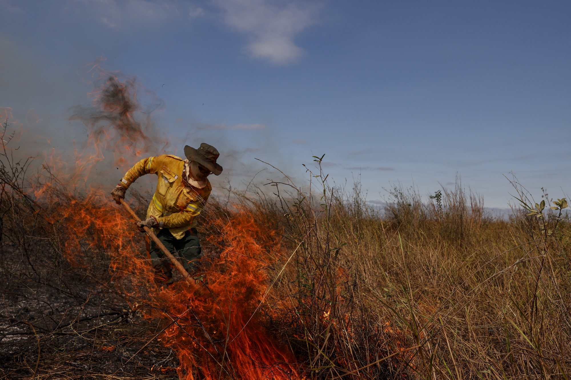 epa11440664 A firefighter from Prevfogo, a wildfire extinguishment brigade of the Brazilian Institute of Environment and Renewable Natural Resources (IBAMA), takes part in extinguishing a fire in the Brazilian Pantanal, in Corumba, Brazil, 26 June 2024. The fires ravaging the Pantanal, the world&#039;s largest wetland shared by Brazil, Paraguay, and Bolivia, are leaving a blanket of smoke and ashes across the biome, experiencing one of the worst droughts in history.  EPA/Sebastiao Moreira