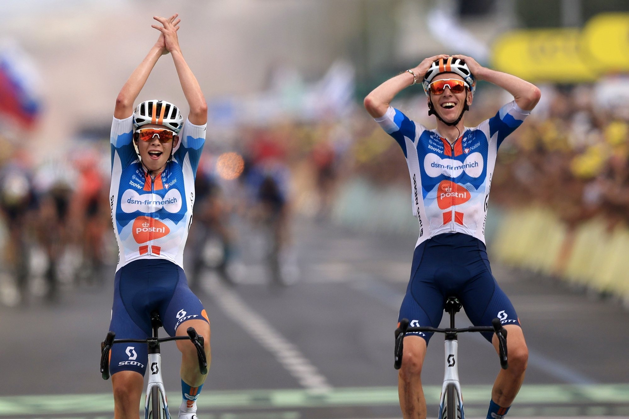 epa11445200 French rider Romain Bardet (R) of Team DSM reacts as he crosses the finish line next to his teammate Dutch rider Frank van den Broek (L) to win the first stage of the 2024 Tour de France cycling race over 206km from Florence to Rimini, Italy, 29 June 2024.  EPA/GUILLAUME HORCAJUELO