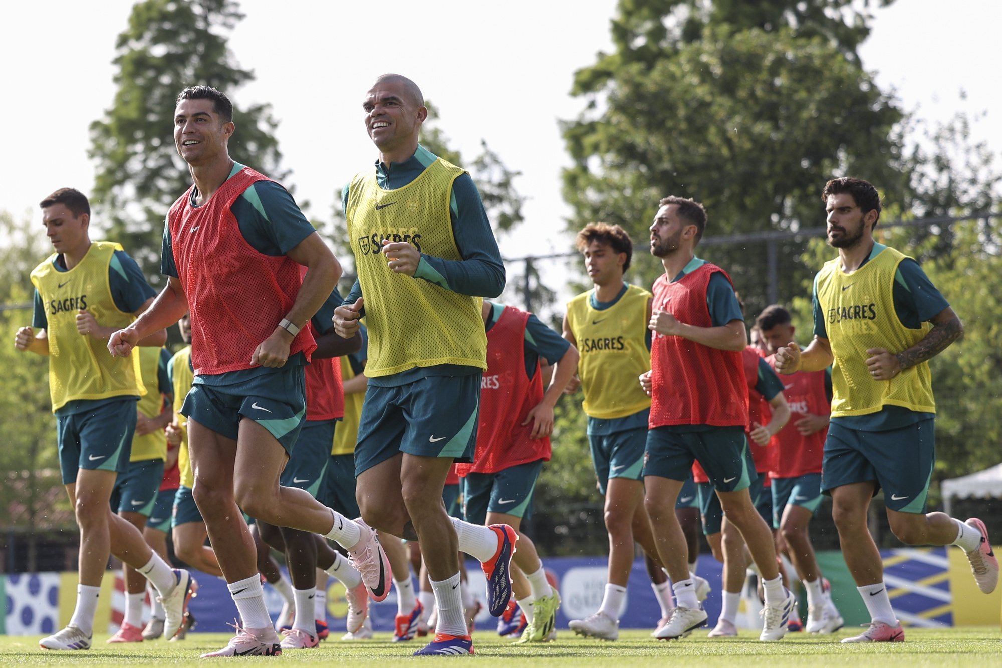 epa11445490 Portugal national soccer team players Cristiano Ronaldo (L) and Pepe during a training session in Marienfeld, Harsewinkel, Germany, 29 June 2024. Portugal plays Slovenia in a UEFA EURO 2024 round of 16 match on 01 July.  EPA/MIGUEL A. LOPES