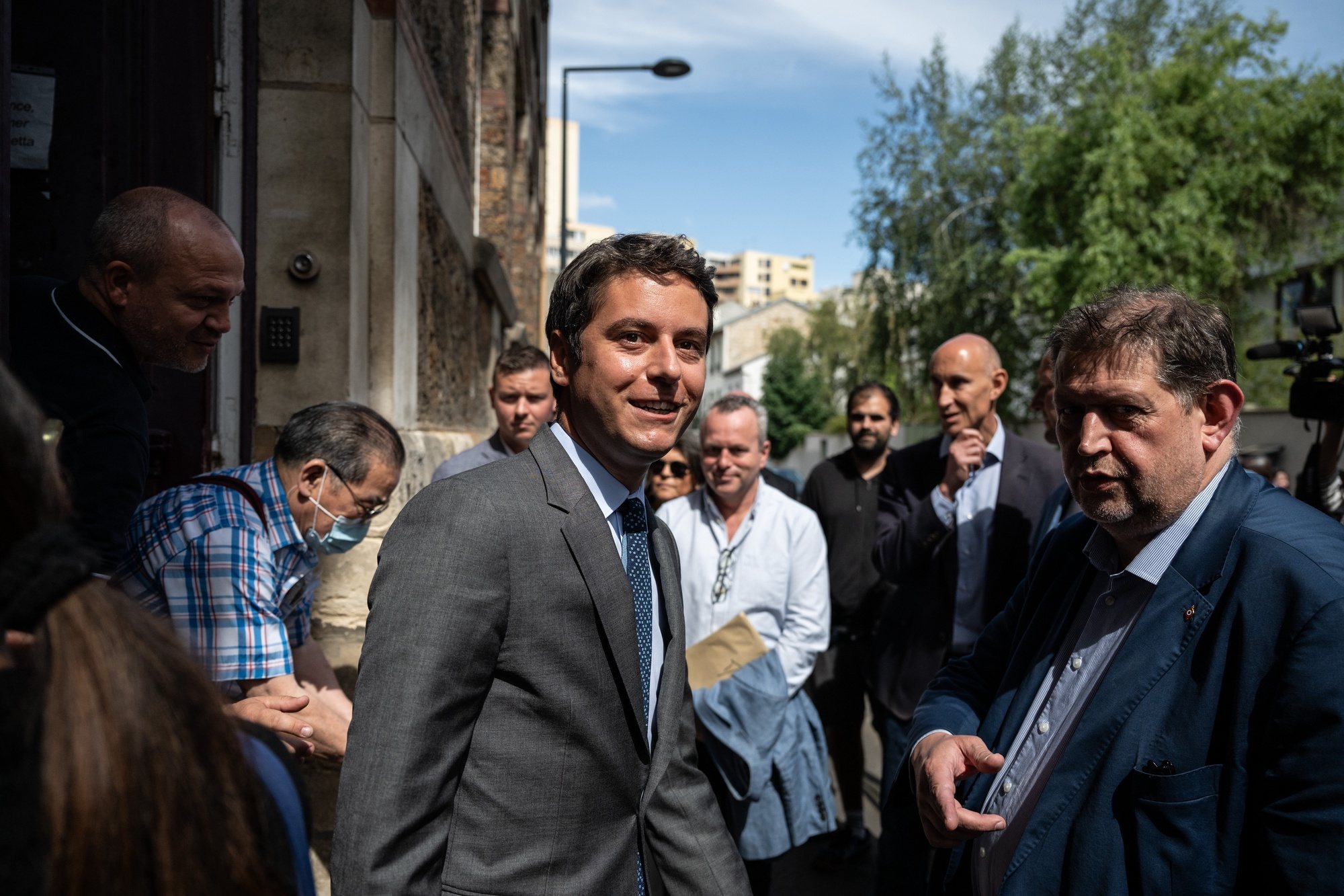 epa11446945 France&#039;s Prime Minister Gabriel Attal (C) leaves a polling station after voting in the first round of the parliamentary elections in Vanves, southwestern Paris, France, 30 June 2024. A divided France is voting in high-stakes parliamentary elections that could see the anti-immigrant and eurosceptic party of Marine Le Pen sweep to power in a historic first. The candidates formally ended their frantic campaigns at midnight on 28 June, with political activity banned until the first round of voting.  EPA/ARNAUD FINISTRE / POOL  MAXPPP OUT
