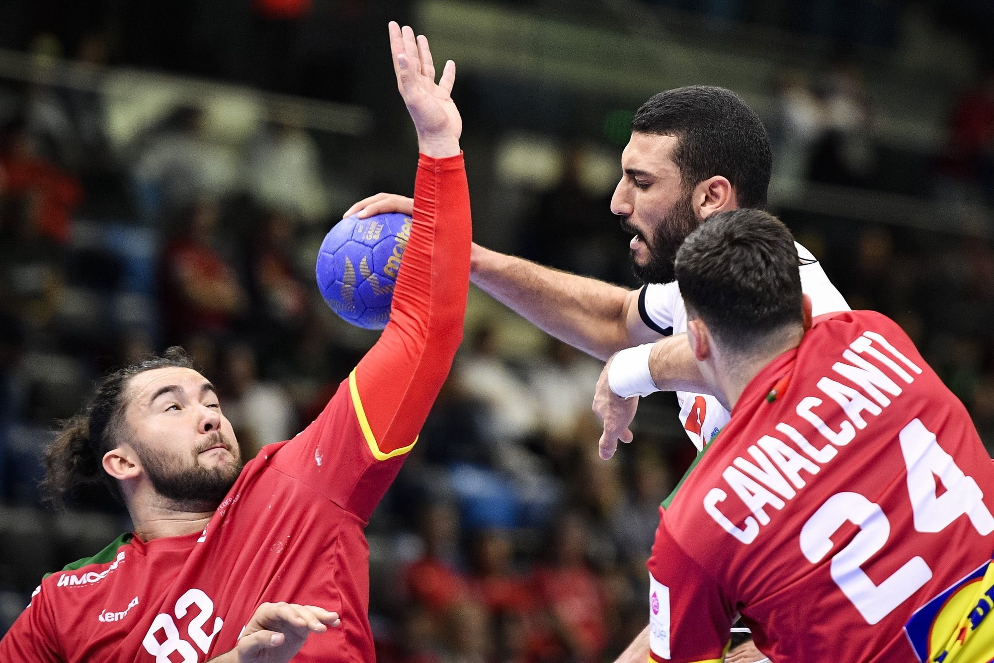 epa11224410 Hazem Baha (C) of Tunisia is blocked by Alexandre Cavalcanti (R) and Luis Frade of Portugal during the 2024 Olympic Games qualifying handball match between Portugal and Tunisia in Tatabanya, Hungary, 16 March 2024.  EPA/Boglarka Bodnar HUNGARY OUT