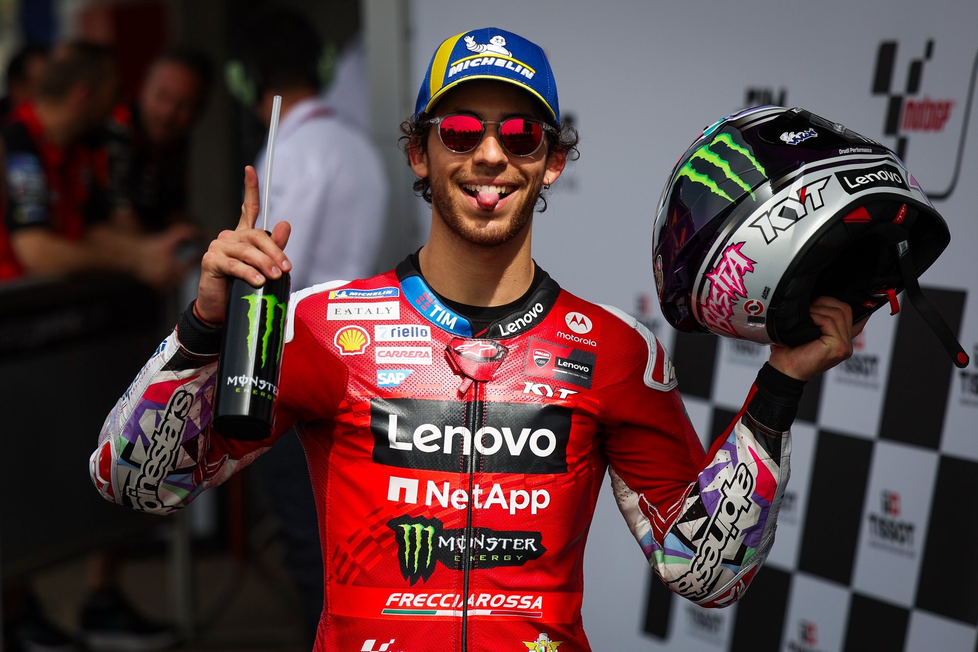 epa11238567 Enea Bastianini of Italy and Ducati Lenovo Team celebrates after getting pole position of the Motorcycling Grand Prix of Portugal, in Portimao, Portugal, 23 March 2024. The 2024 Motorcycling Grand Prix of Portugal is held on 24 March.  EPA/JOSE SENA GOULAO
