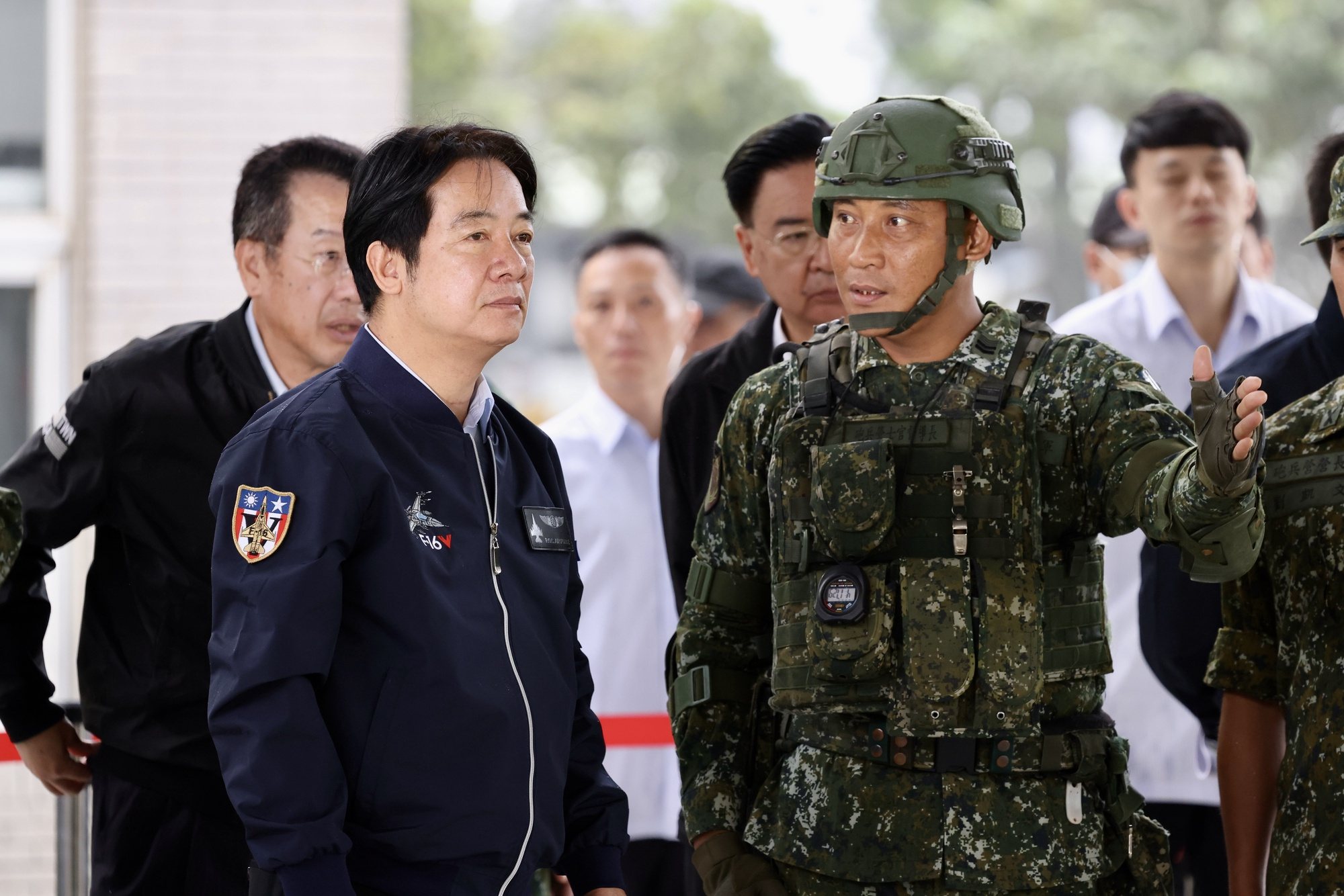 epa11374580 Taiwan President William Lai (Lai Ching-te) (L), inspects army personnel during his visit inside military base in Haulien, Taiwan, 28 May 2024. During the visit, Lai gave thanks for the efforts and respect of the Taiwanese armed forces, specifically in reference to the recently concluded Chinese military exercise that encircled Taiwan.  EPA/RITCHIE B. TONGO