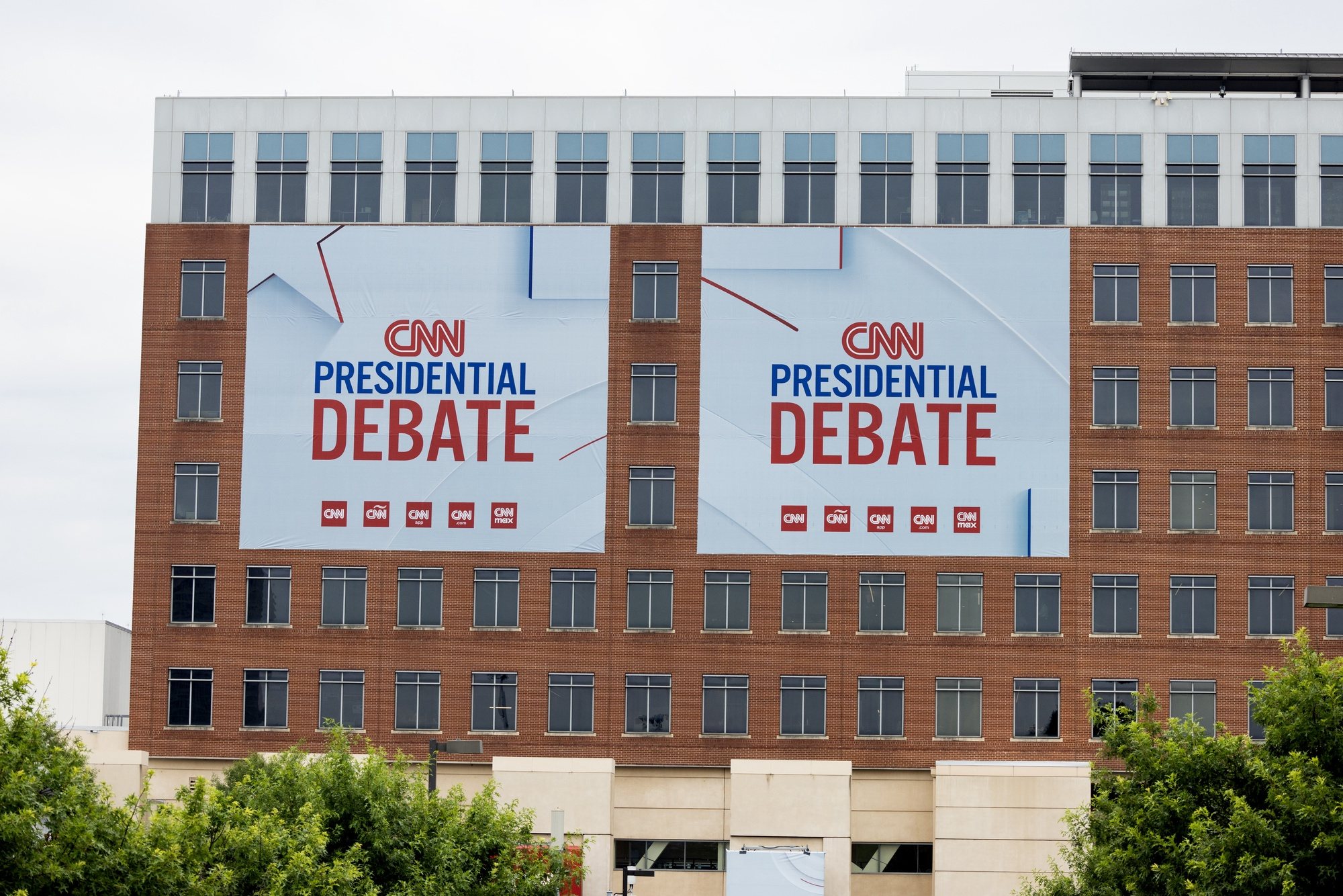 epa11441975 Signs are visible at Turner Studios before the first 2024 presidential election debate between US President Joe Biden and former US President Donald J. Trump in Atlanta, Georgia, USA, 27 June 2024. The first 2024 US presidential election debate will be held on 27 June and is hosted by CNN.  EPA/MICHAEL REYNOLDS