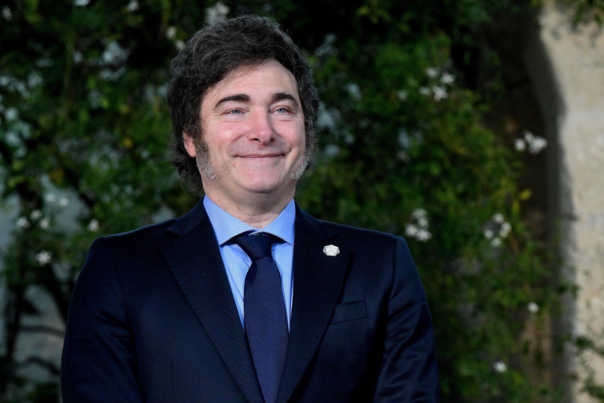 epa11410455 Argentinian President Javier Milei smiles before posing for a group photo with G7 heads of states and the heads of delegation of outreach countries during the second day of the G7 Summit in Borgo Egnazia, Italy, 14 June 2024. The 50th G7 summit brings together the Group of Seven member states leaders in Borgo Egnazia resort in southern Italy from 13 to 15 June 2024.  EPA/ETTORE FERRARI