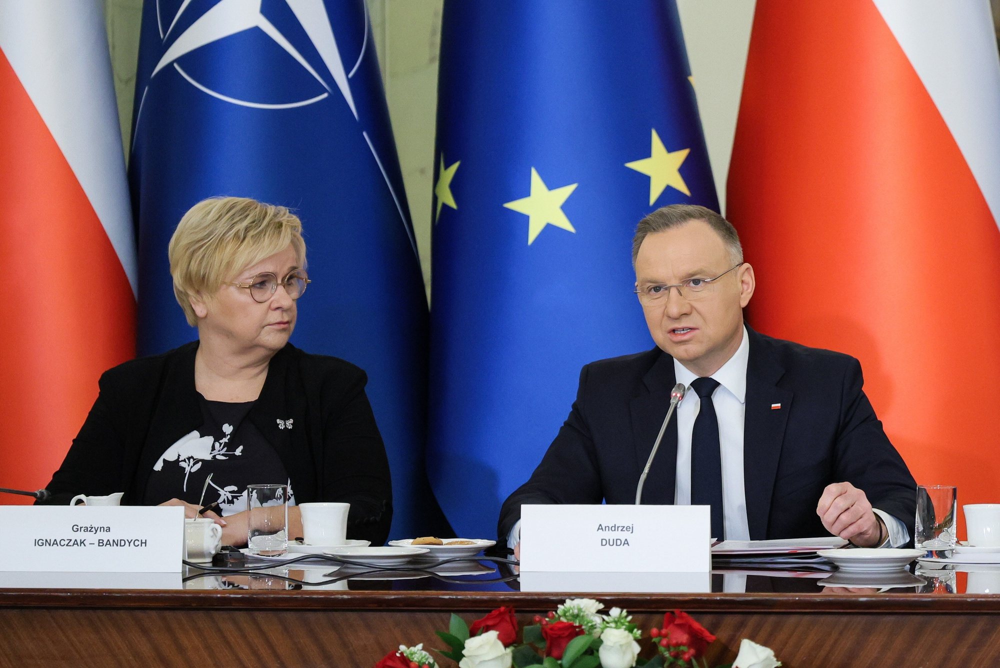 epa11214275 Polish President Andrzej Duda (R) and head of the Polish President Chancellery Grazyna Ignaczak-Bandych (L) attend a meeting of the National Security Council (BBN) at the Presidential Palace in Warsaw, Poland, 11 March 2024. The meeting was held before the departure of Polish President Andrzej Duda and Prime Minister Donald Tusk on their visit to Washington on 12 March, where they will meet the US president on the 25th anniversary of Poland&#039;s accession to NATO.  EPA/PAWEL SUPERNAK POLAND OUT