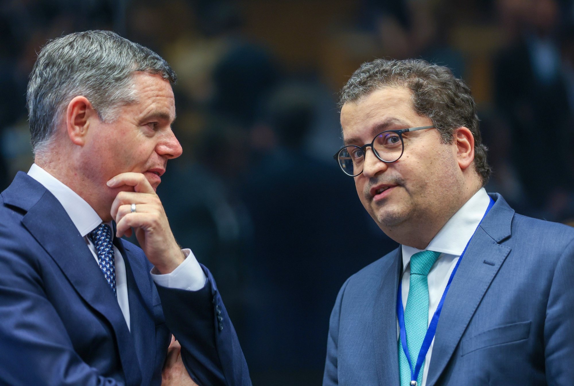 epa11425527 President of the Eurogroup Paschal Donohoe (L) and Portuguese Finance Minister Joaquim Miranda Sarmento (R) at the start of a Eurogroup finance ministers meeting in Luxembourg City, Luxembourg, 20 June 2024.  EPA/OLIVIER HOSLET