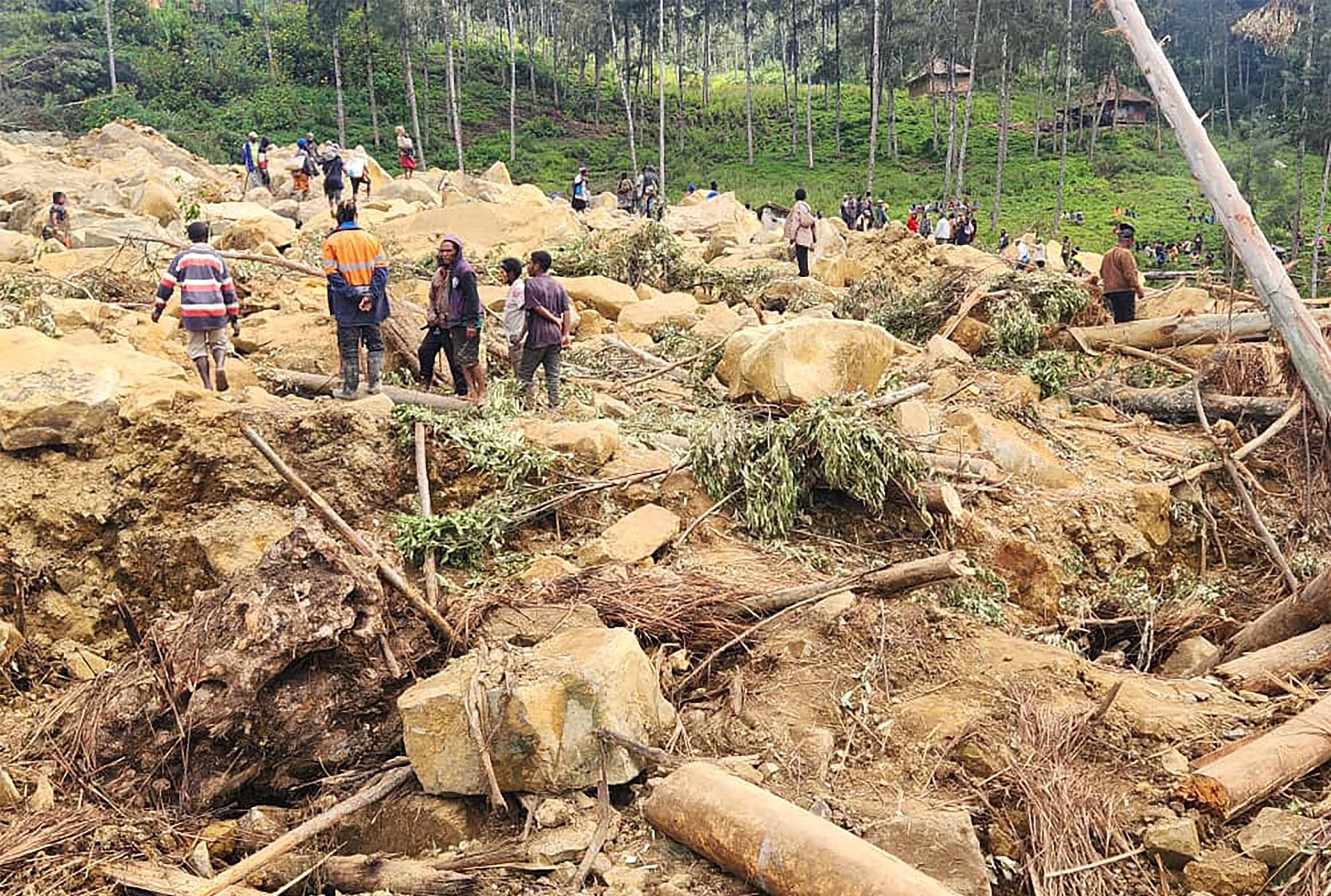 epa11374596 A handout photo made available by the International Organization for Migration (IOM), shows local inhabitants searching for missing relatives at the landslide site in Tulpar community, Yambali Ward, Enga province, Papua New Guinea, 28 May 2024. According to a senior official with the International Organization for Migration (IOM), on 26 May, more than 670 people were feared dead, after a landslide hit the Highlands region of Papua New Guinea early on 24 May. The country&#039;s National Disaster Center raised the potential death toll to 2,000 people in a letter to the UN released on 27 May.  EPA/International Organization for Migration (IOM) - PNG/ HANDOUT   HANDOUT EDITORIAL USE ONLY/NO SALES HANDOUT EDITORIAL USE ONLY/NO SALES