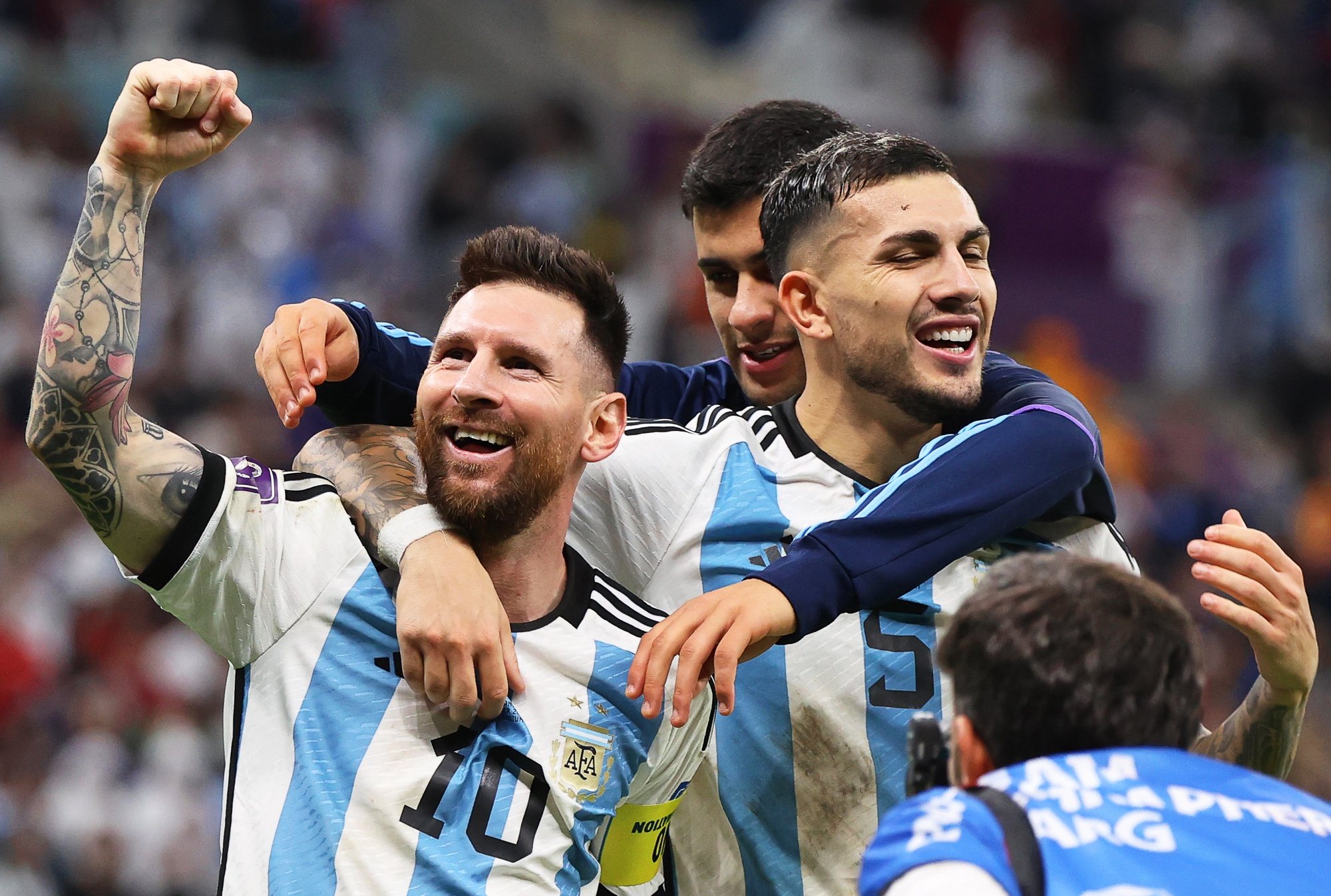 epa10358285 Lionel Messi (L) of Argentina and teammates celebrate after winning the penalty shoot-out of the FIFA World Cup 2022 quarter final soccer match between the Netherlands and Argentina at Lusail Stadium in Lusail, Qatar, 09 December 2022.  EPA/Mohamed Messara