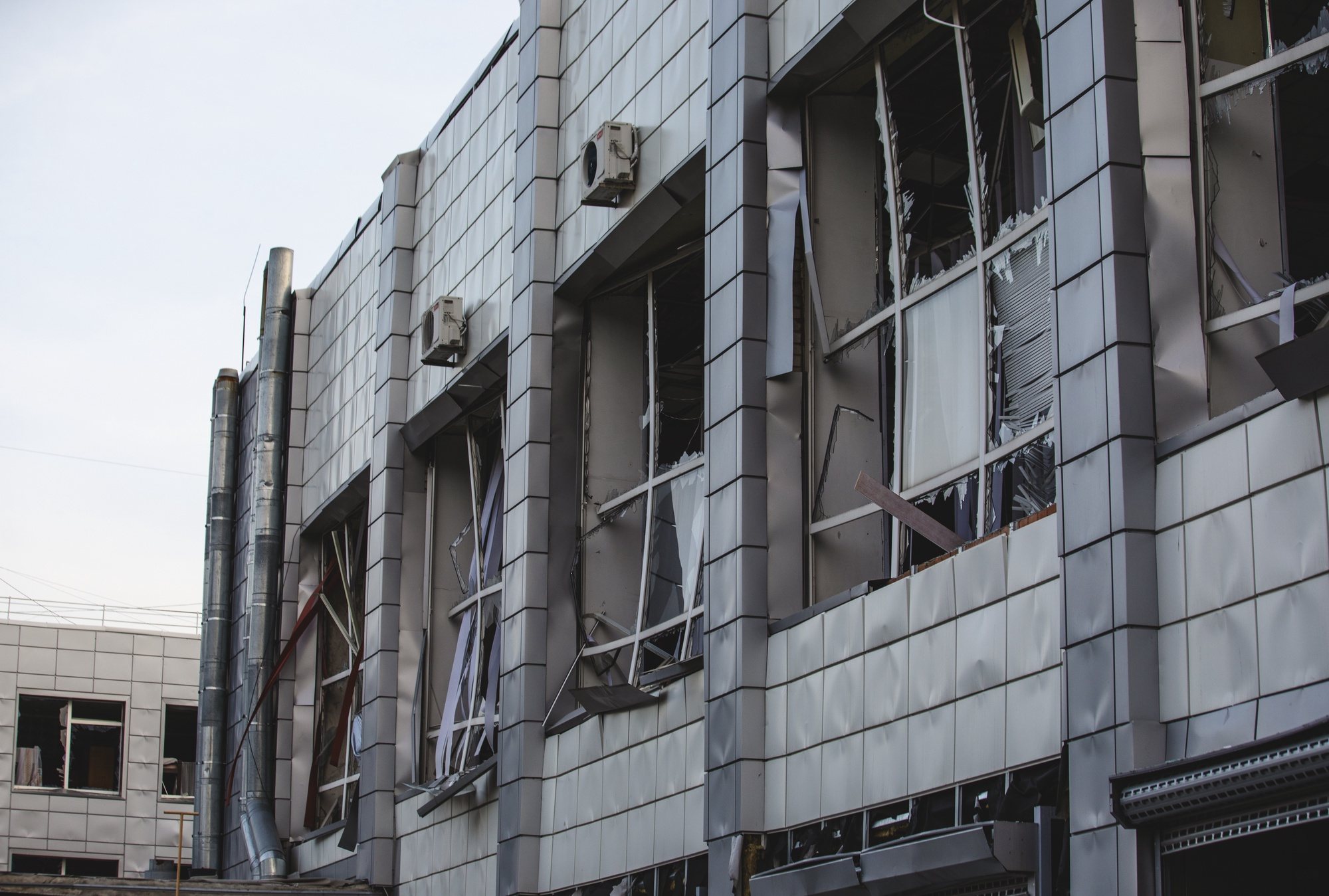 epa11255787 A view of roken windows at the site of a rocket attack on an educational institution building in the city of Dnipro, Dnipropetrovsk region, southeastern Ukraine, 02 April 2024, amid the Russian invasion. At least 13 people were injured in Dnipro, including five children, as a result of the rocket attack on an educational institution and kindergarten building, according to the State Emergency Service.  EPA/ARSEN DZODZAIEV 48547