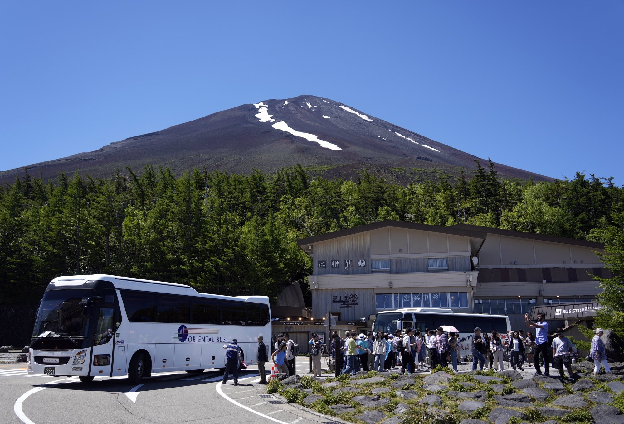 epa11421883 Tourists gather at Mount Fuji 5th station in Yamanashi prefecture, Japan, 19 June 2024. For the first time, the prefecture will start collecting a mandatory hiking fee of 2000 yen (about 12 euros) per person and an optional &#039;donation fee&#039; of 1000 yen (6 euros) per person for climbing the Mount Fuji from the 5th station. An online reservation system started operations on 20 May 2024 ahead of the opening of the Mt. Fuji Yoshida Route on 01 July 2024. Also, access to the Yoshida Route will be limited to 4000 people per day during the hiking season from 01 July until 10 September 2024. According to data released by Japan National Tourism Organization on 19 June 2024, the number of foreign visitors traveling to Japan topped the three million mark for the third month in a row, an increase of 60 percent from the same month of 2023.  EPA/FRANCK ROBICHON