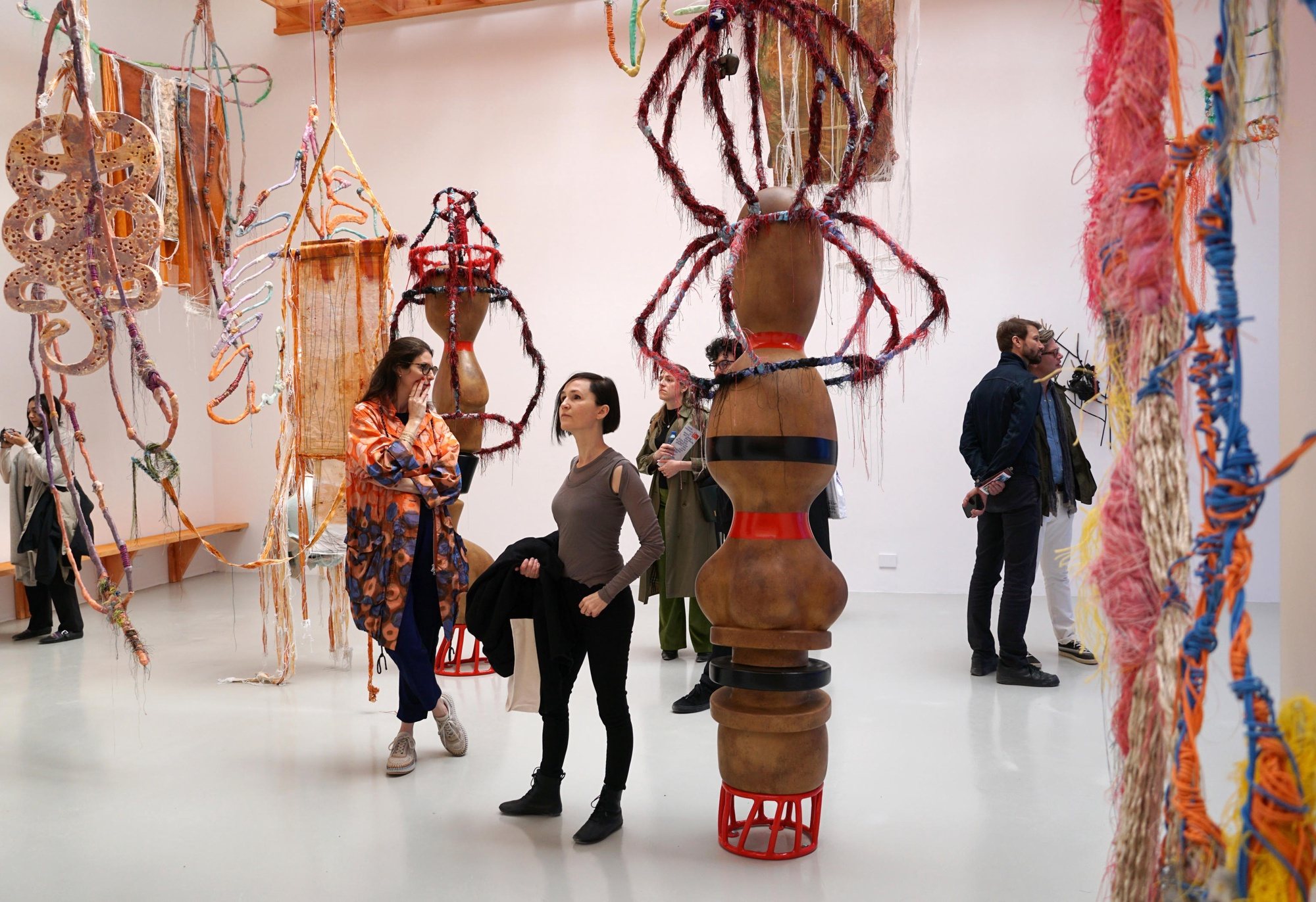 epa11282849 Visitors observe works of French artist Julien Creuzet in the French pavilion, at the Biennale Gardens in Venice, Italy, 16 April 2024. The 60th international art exhibition La Biennale di Venezia runs officialy from 20 April to 24 November 2024.  EPA/ANDREA MEROLA