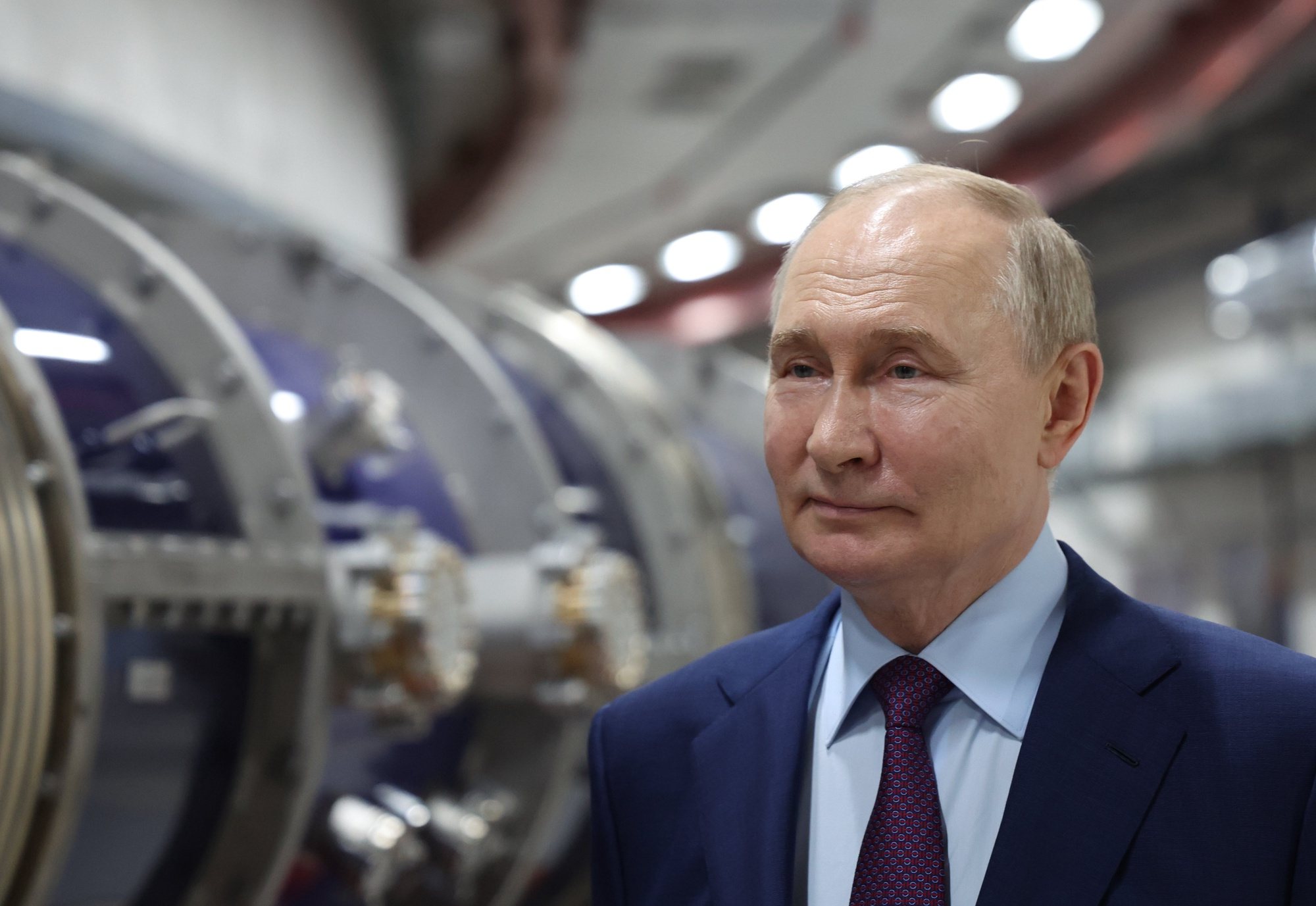epa11408501 Russian President Vladimir Putin examines the NICA (Nuclotron-based Ion Collider facility) collider ring for heavy ions, at the Joint Institute for Nuclear Research, in Dubna, Moscow region, Russia, 13 June 2024.  EPA/ALEXANDER KAZAKOV / SPUTNIK / KREMLIN POOL MANDATORY CREDIT