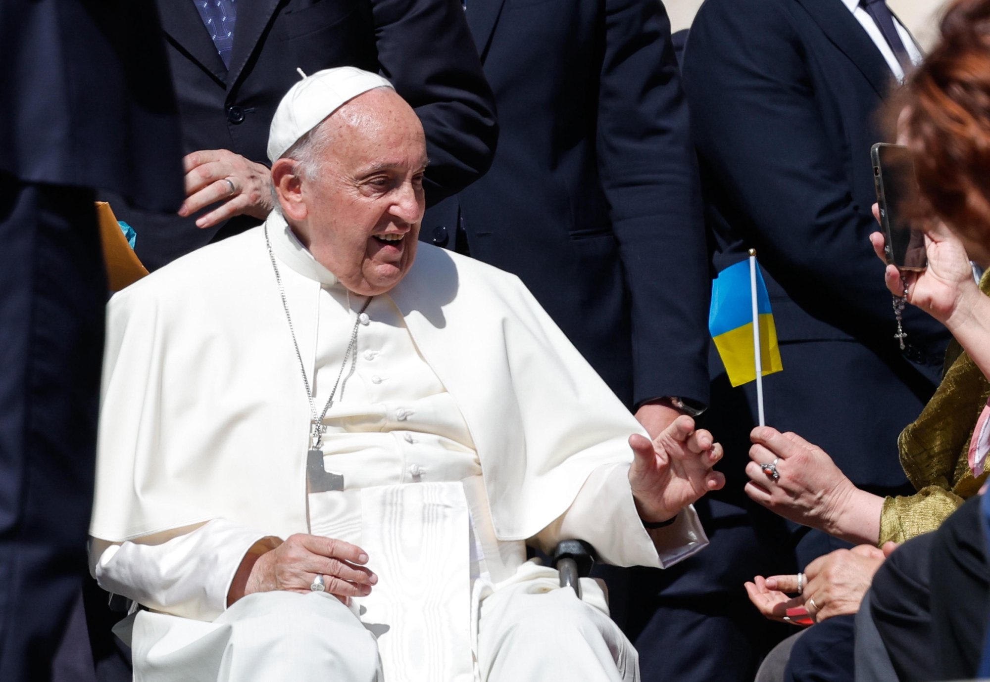 epa11390639 A faithful hands Pope Francis a Ukrainian flag during his weekly general audience in Saint Peter&#039;s Square, Vatican City, 05 June 2024.  EPA/GIUSEPPE LAMI