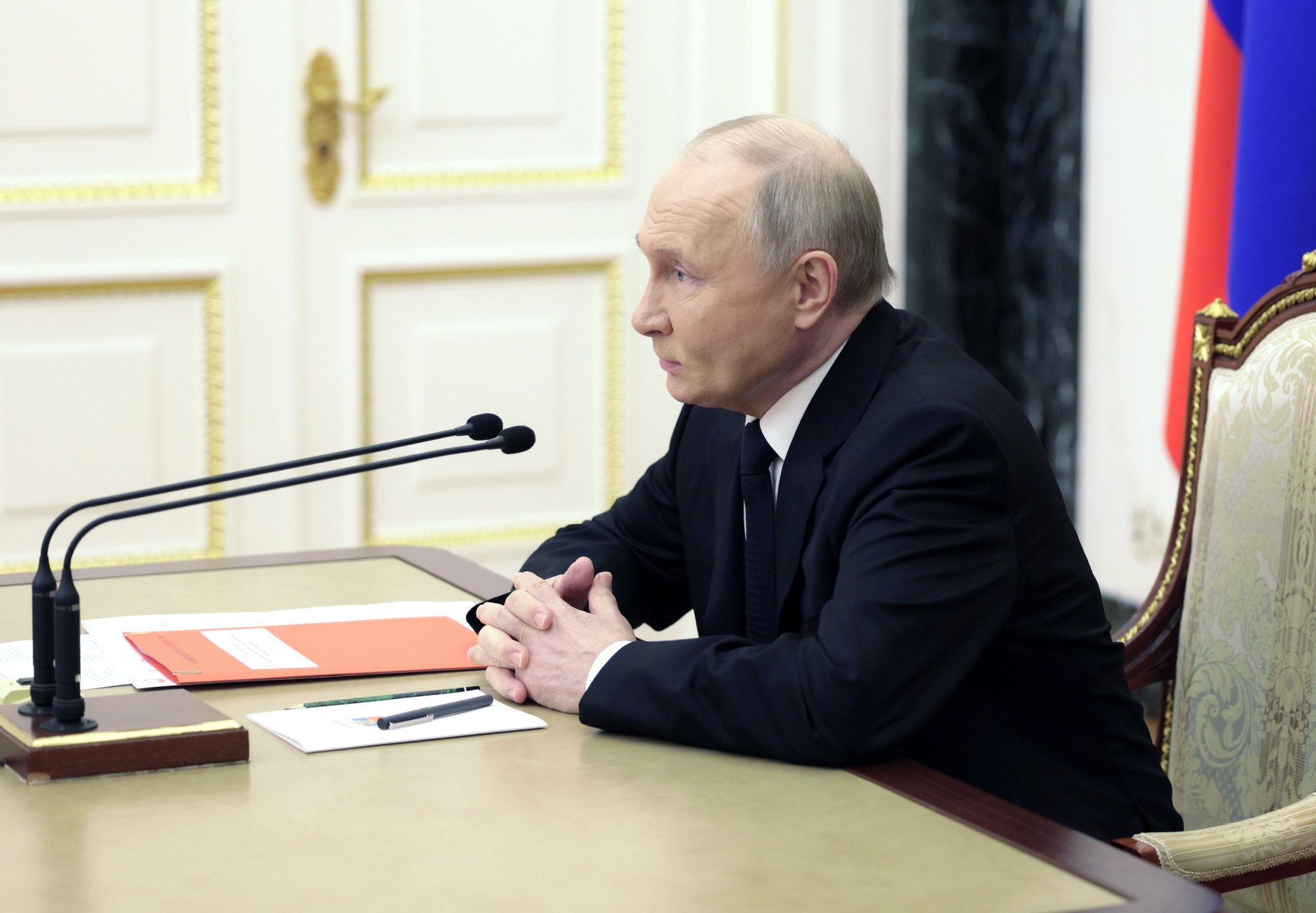 epa11273222 Russia President Vladimir Putin holds a videoconference meeting to discuss the flood aftermath in the Orenburg, Kurgan, and Tyumen regions, in Moscow, Russia, 11 April 2024. Regional governor Denis Pasler informed Russian President Vladimir Putin that the flood situation in the Orenburg region has reached its peak. The most difficult situation is in Orenburg. According to the Russian Ministry of Emergency Situations, the water level in the Ural River has risen to 1060 cm. There are 2028 residential buildings and 2522 household plots remaining in the flood zone. The authorities of the Orenburg region have reported that 7,800 people, including 2,117 children, have been evacuated from flooded homes and personal plots. The most challenging flood situation remains in Orsk, Orenburg, Orenburg, and Ilek regions.  EPA/GAVRIIL GRIGOROV/SPUTNIK/KREMLIN POOL MANDATORY CREDIT