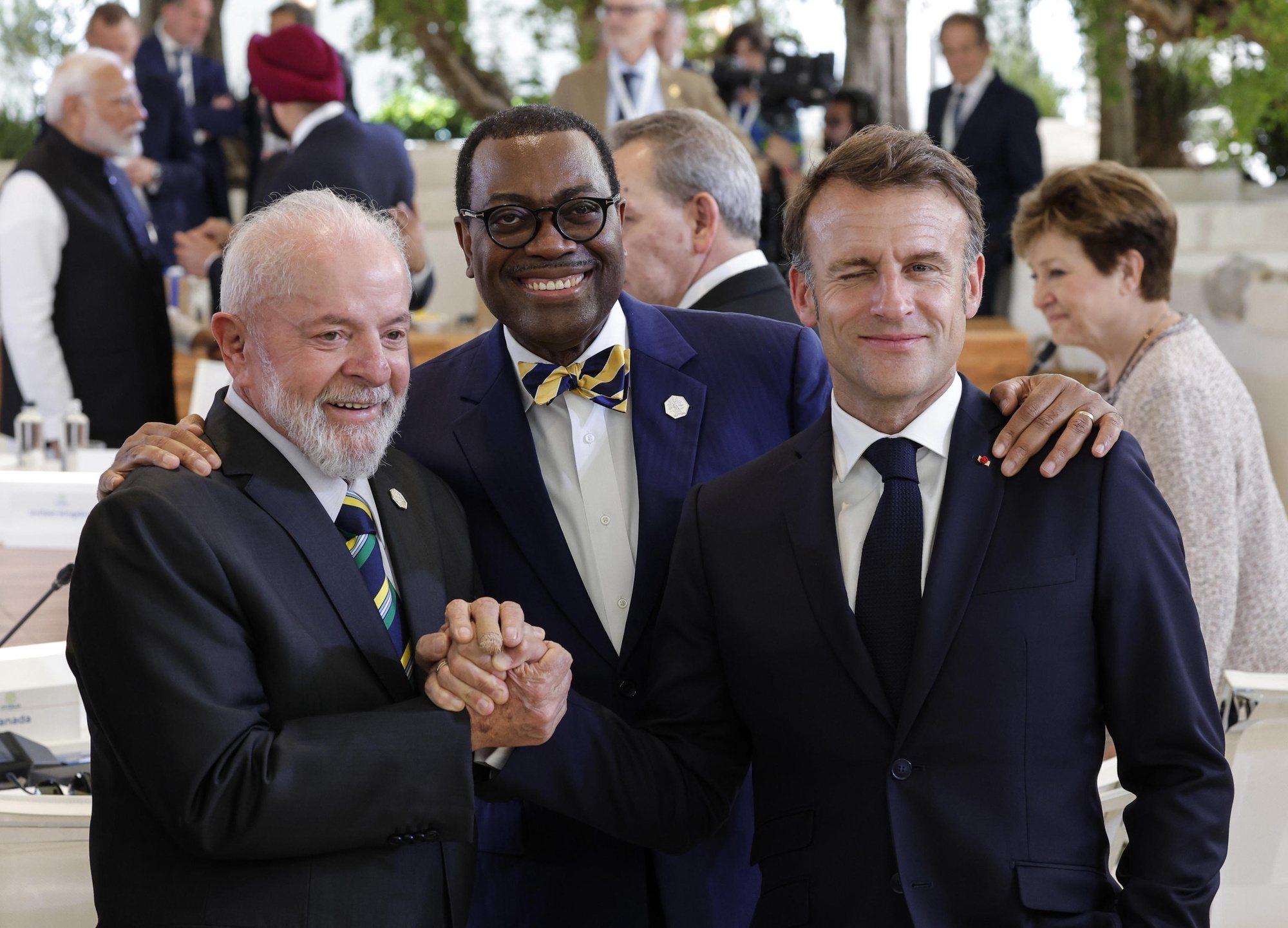 epa11410021 (L-R) Brazilian President Luis Ignacio Lula da Silva, African Development Bank (AFDB) President Akinwumi Adesina and French President Emmanuel Macron attend &#039;Session VI: Artificial intelligence, energy, Africa-Mediterranean&#039; on the second day of the G7 summit, in Borgo Egnazia, Apulia region, southern Italy, 14 June 2024. The 50th G7 Summit brings together the Group of Seven member states leaders in Borgo Egnazia resort from 13 to 15 June 2024.  EPA/GIUSEPPE LAMI