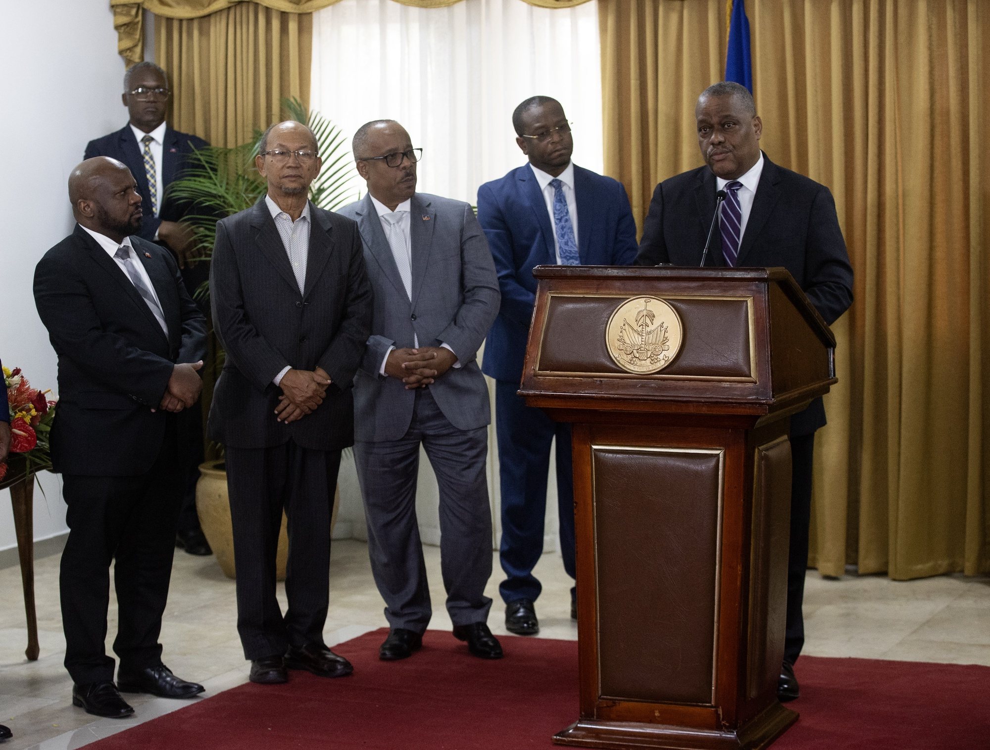 epa11388225 Haitian Prime Minister-designate Garry Conille speaks before the members of the Presidential council of transition during the official presentation of the extension of the decree of his designation in Port-Au-Prince, Haiti, 03 June 2024. Conille arrived in the country on 01 June from abroad to assume office in a nation plunged into an unprecedented socio-political crisis. Haiti is waiting for the arrival of the Multinational Mission to support the security, led by Kenia and with the support of the UN, with the finality to stop the violence in the caribbean country.  EPA/ORLANDO BARRIA