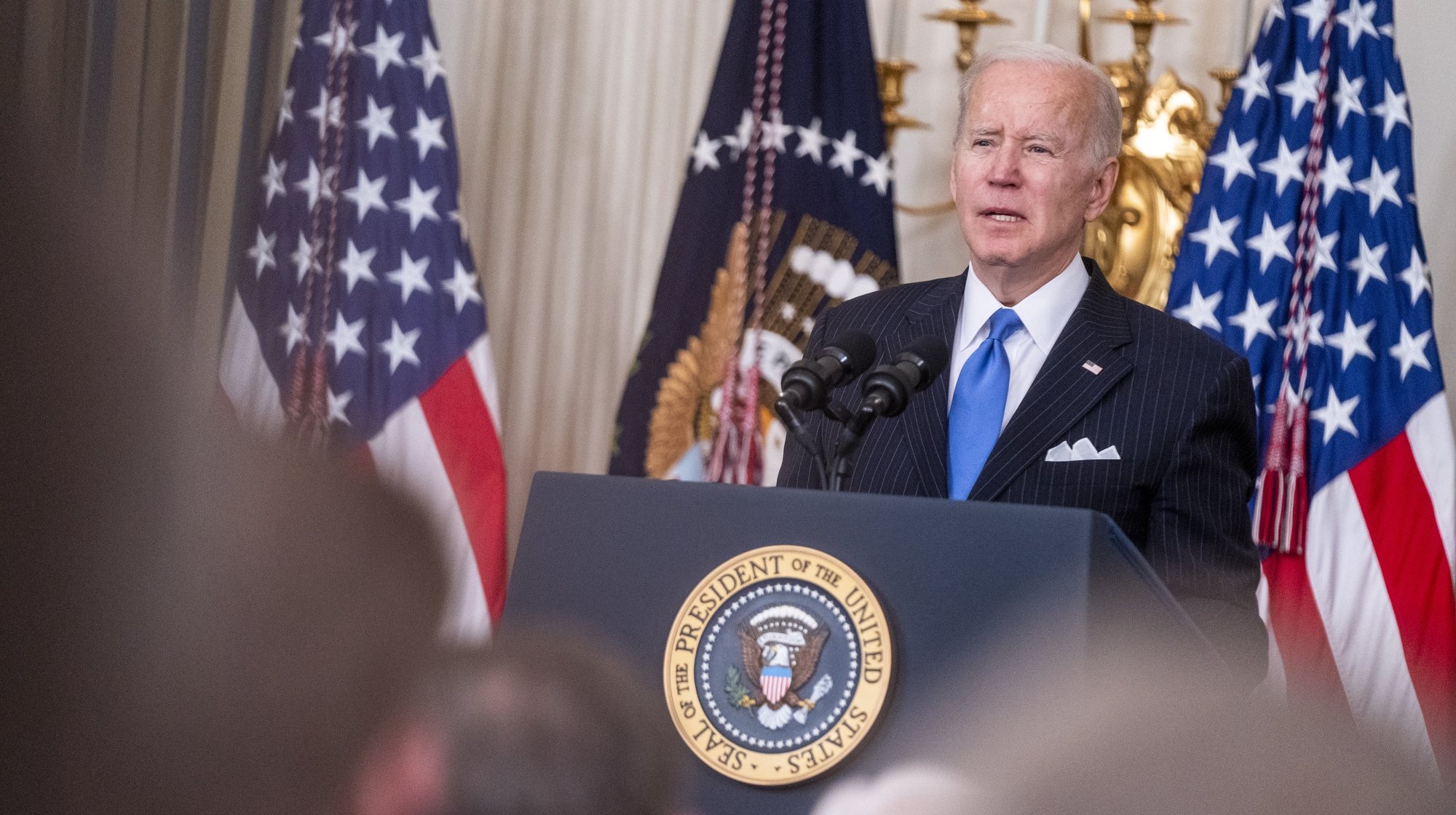 epa09874624 US President Joe Biden delivers remarks during a bill signing ceremony for H.R. 3076, the Postal Service Reform Act of 2022 in the State Dining Room of the White House in Washington, DC, USA, 06 April 2022.  EPA/SHAWN THEW / POOL