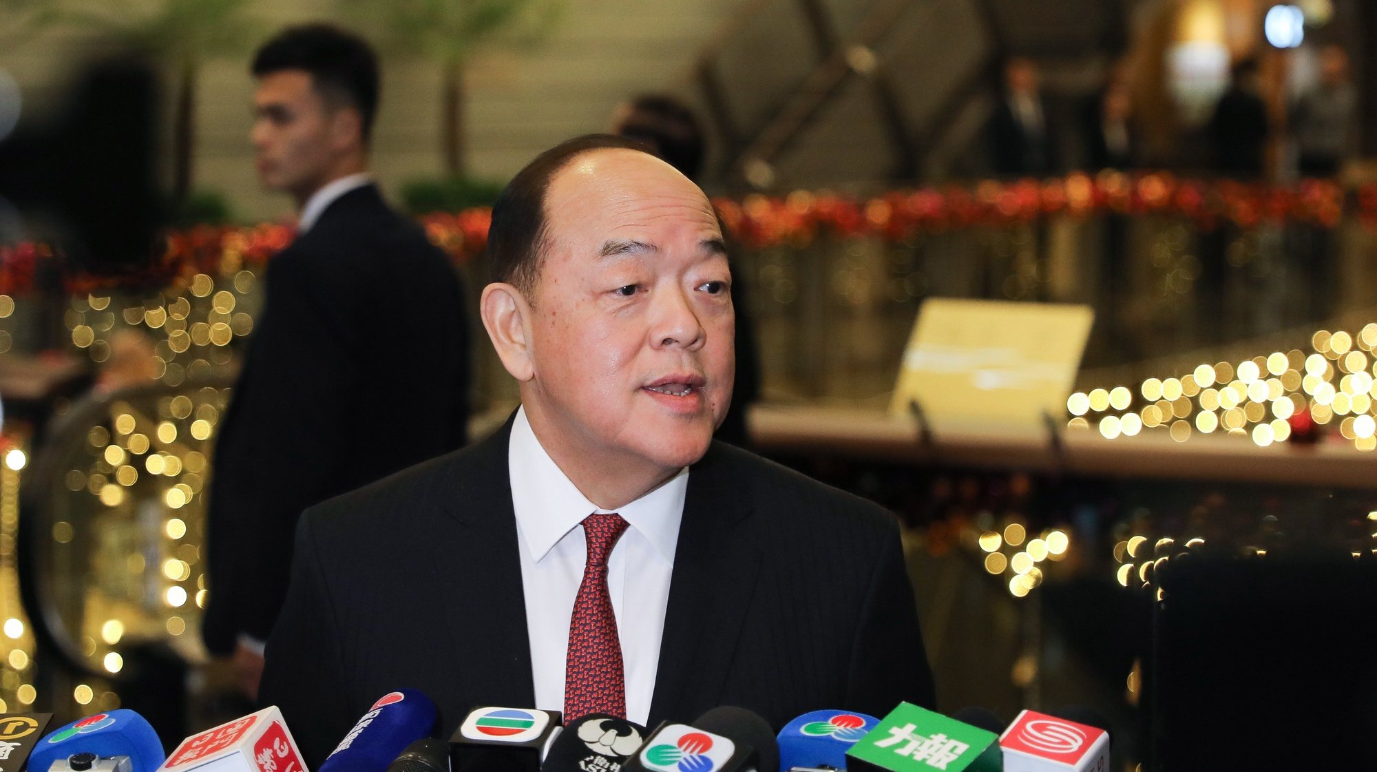 epa08083137 New Maca&#039;s SAR Chief Executive Ho Iat Seng talks to the press during a reception at Macao Tower under the Macao Special Administrative Region of the People&#039;s Republic of China 20th anniversary celebrations in Macao, China, 20 December 2019. Macao had been a Portuguese colony until 1999 when it returned to Chinese rule under the &#039;one country, two systems&#039; principle.  EPA/JOAO RELVAS