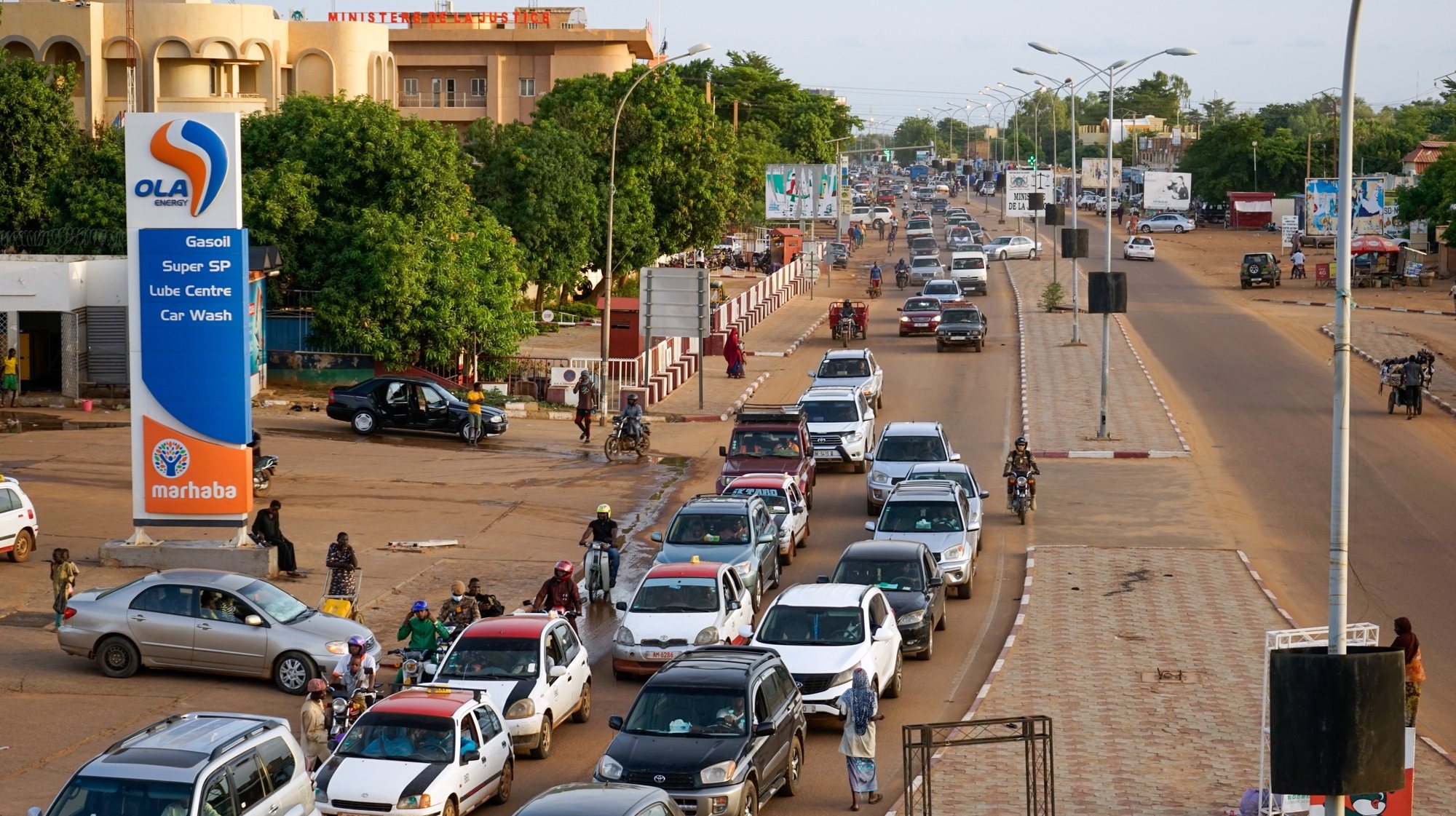epa10781866 Cars drive along a main road in Niamey, Niger, 02 August 2023. Several French military planes took off from the capital of Niger during the evening of 01 August to evacuate European citizens six days after the military coup against President Mohamed Bazoum on 26 July.  EPA/ISSIFOU DJIBO