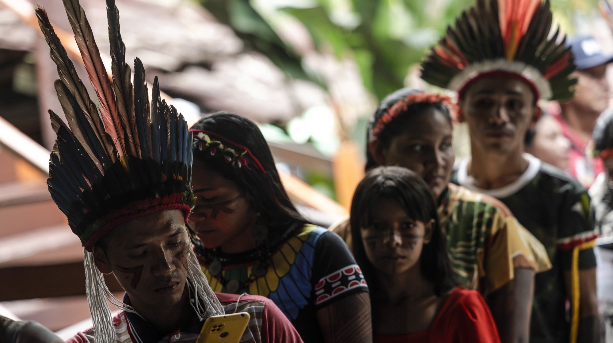 epa10784951 Indigenous people line up to receive lunch at the Igarape Park, in Belem, Para state, Brazil, 04 August 2023. The park will serve as accommodation for the indigenous communities visiting the city this week for the Amazon Dialogues. During these three days of debates, representatives from different sectors of society will debate, from 04 to 06 August, the future of the Amazon biome. The leaders of the countries of the Amazon Cooperation Treaty Organization (OTCA) will gather in the capital of Para state on 08 and 09 August for a summit, where they will receive the conclusions from the Amazon Dialogues.  EPA/Antonio Lacerda