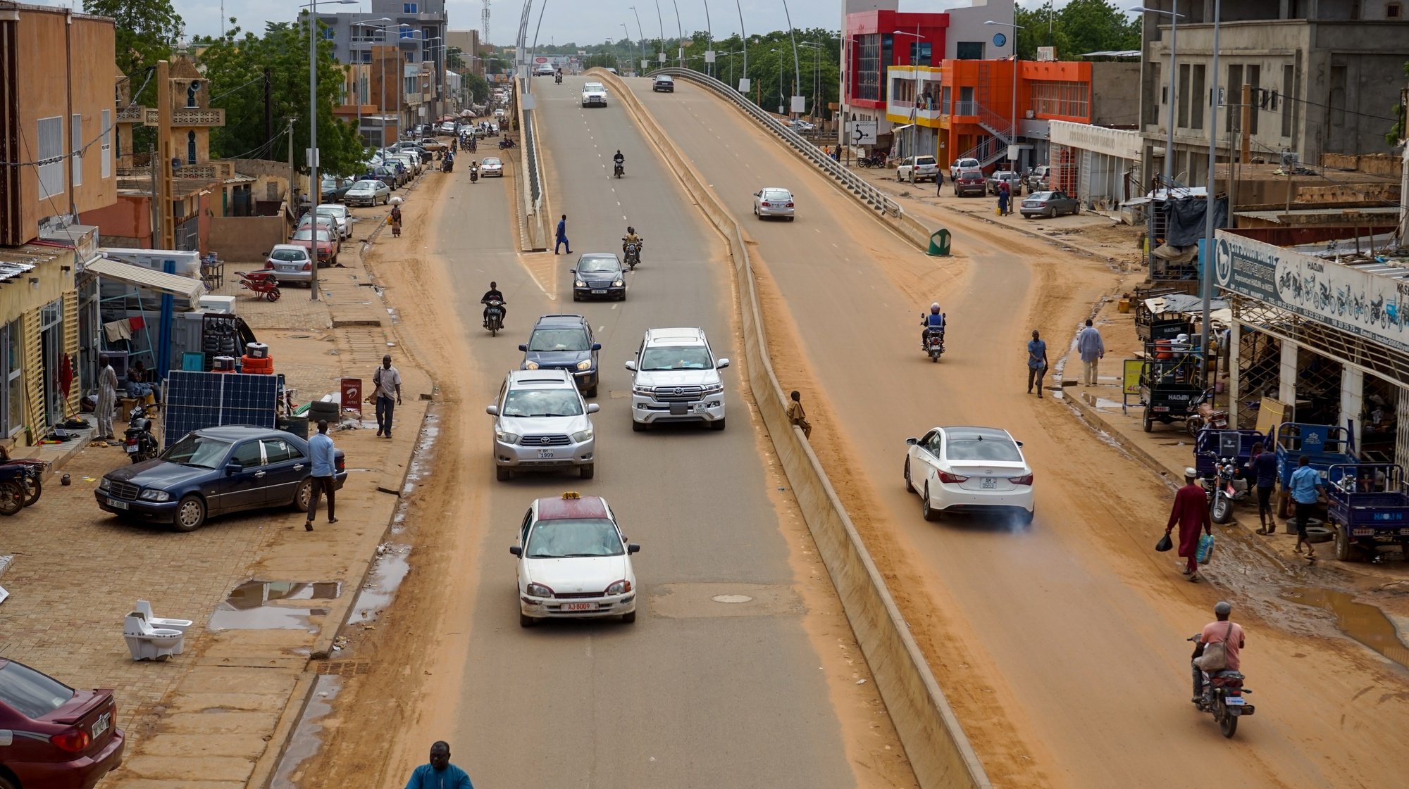 epa10789559 Cars drive on a main road in Niamey, Niger, 07 August 2023. Nigerâ€™s junta closed the countryâ€™s airspace and accused foreign powers of preparing an attack, after the junta defied a deadline to restore ousted President Mohamed Bazoum.  EPA/ISSIFOU DJIBO
