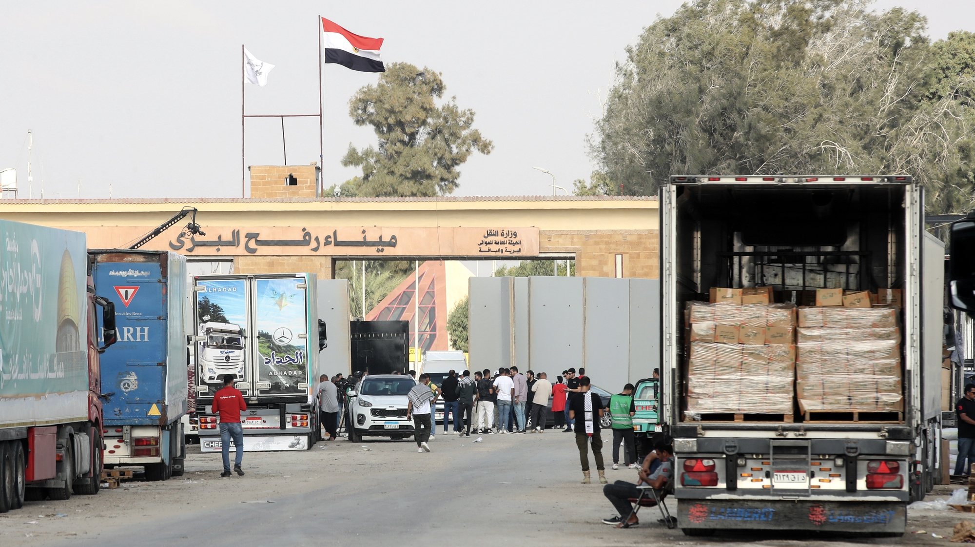 epa10936148 The humanitarian aid convoy bound for the Gaza Strip, is seen parked outside Rafah border gate, at the Rafah border crossing, Egypt, 24 October 2023. More than 5,000 Palestinians and over 1,400 Israelis have been killed, according to the Israel Defense Forces (IDF) and the Palestinian health authority, since Hamas militants launched an attack against Israel from the Gaza Strip on 07 October.  EPA/KHALED ELFIQI