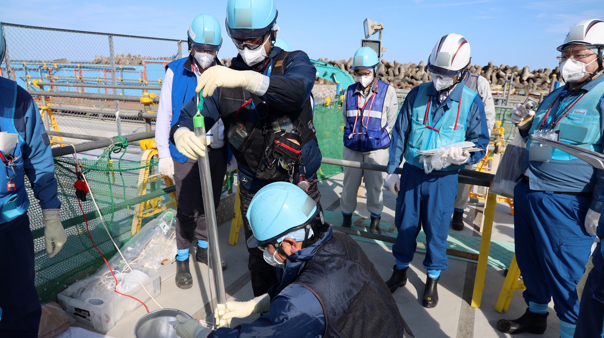 epa10900913 A handout photo made available by Tokyo Electric Power Company Holdings Inc. (TEPCO) shows staff members sampling water from the upper-stream storage, two days before the second discharge of treated radioactive water at the Fukushima Daiichi nuclear power plant in Okuma, Fukushima prefecture, Japan, 03 October 2023 (issued 05 October 2023). On 05 October 2023, plant operator Tokyo Electric Power Company Holdings Inc. (TEPCO) started the second offshore discharge of treated radioactive water containing radioactive tritium diluted with a large amount of seawater from the Fukushima nuclear power plant into the Pacific Ocean.  EPA/TEPCO  HANDOUT EDITORIAL USE ONLY/NO SALES