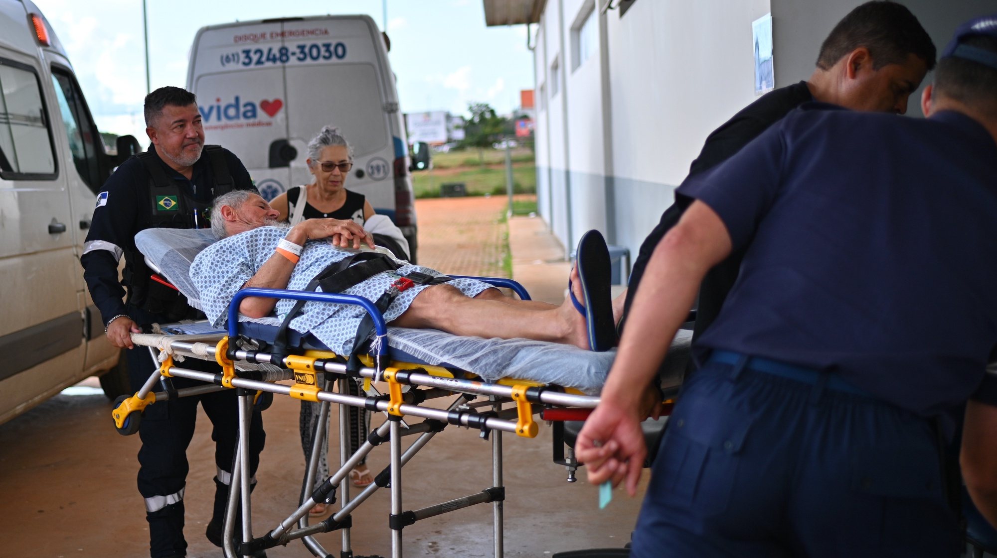 epa11228665 A man is carried on a stretcher upon arrival at a Brazilian Air Force field hospital to treat suspected cases of dengue, on 15 March 2024, in the administrative region of Ceilandia, in Brasilia, Brazil (issued 18 March 2024). Brazil broke the historical record of dengue cases on 18 March, with more than 1.88 million infections in just over two and a half months compared to 1.68 in all of 2015, the year that had the maximum number of records until date. The country already exceeds the total reported in the previous record year by 200,000 cases, according to data released by the Ministry of Health, which represents a new milestone for a disease on the rise due to climate change.  EPA/ANDRE BORGES