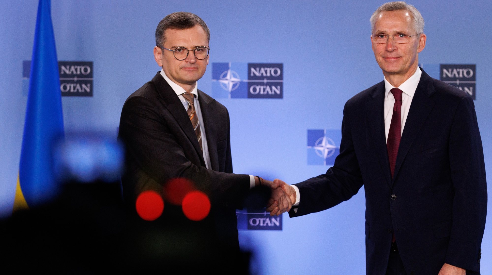 epa11258441 Ukraine&#039;s Foreign Minister Dmytro Kuleba (L) and NATO Secretary-General Jens Stoltenberg shake hands as they deliver a statement during NATO’s 75th anniversary celebration in the Agora to commemorate 75 years of NATO foundation during a North Atlantic Treaty Organization (NATO) Foreign Affairs Ministers meeting in Brussels, Belgium, 04 April 2024. Allied Foreign Affairs Ministers attend a meeting of NATO Ministers of Foreign Affairs at NATO Headquarters in Brussels on 03-04 April as NATO celebrates its 75th anniversary. On 04 April 1949, the 12 founding countries signed the North Atlantic Treaty, called the Washington Treaty. It committed each member to share the risk, responsibilities, and benefits of collective defense.  EPA/OLIVIER MATTHYS