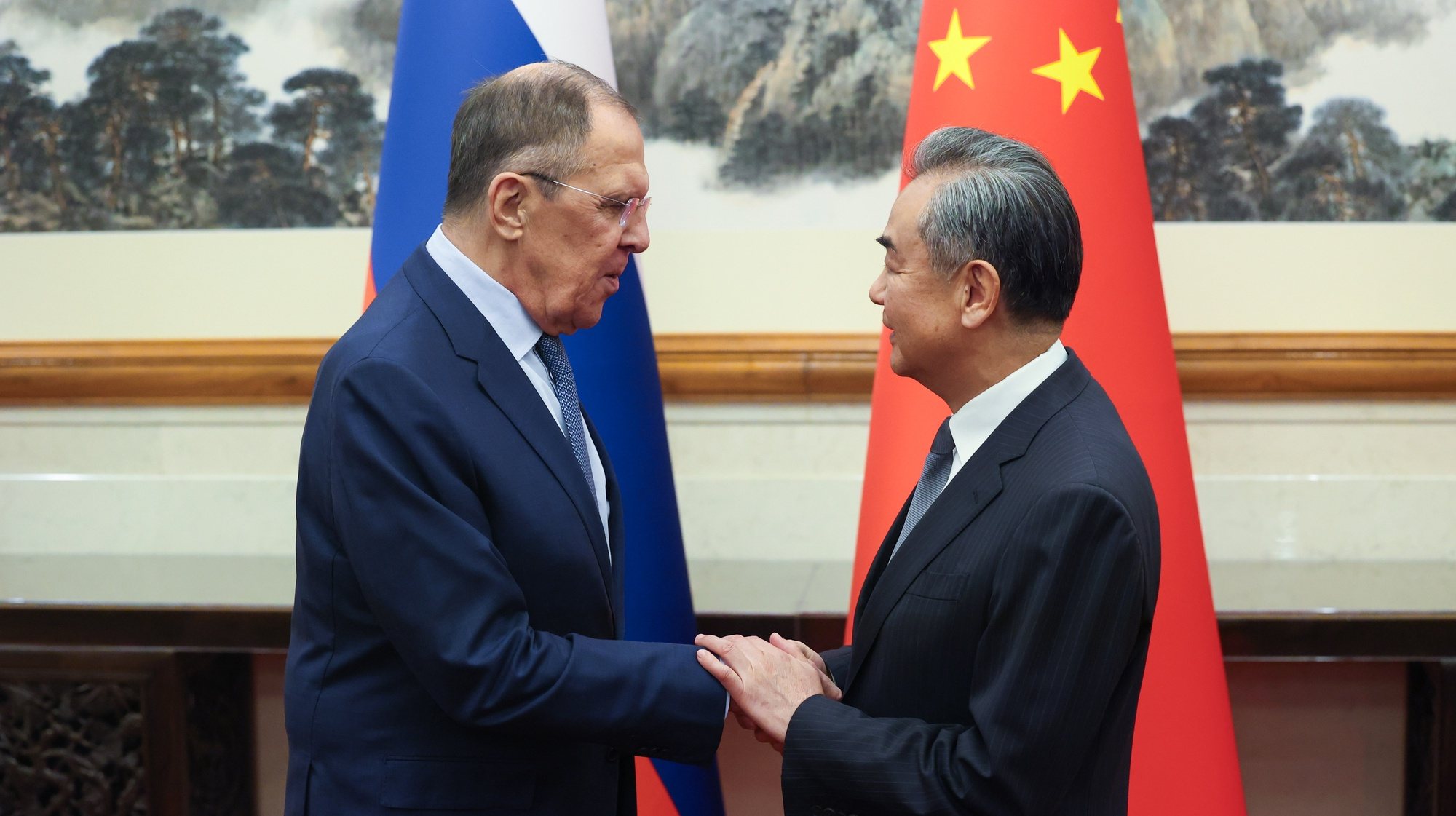 epa10921473 A handout photo made available by the Russian Foreign ministry press service shows Russian Foreign Minister, Sergei Lavrov (L), shaking hands with China&#039;s Foreign Minister, Wang Yi, during their meeting in Beijing, China, 16 October 2023. The Russian president will attend the Third Belt and Road Forum for International Cooperation, which will be held in Beijing on 17-18 October. As part of this trip, he plans to hold talks with the Chinese president.  EPA/RUSSIAN FOREIGN MINISTRY PRESS SERVICE / HANDOUT   HANDOUT EDITORIAL USE ONLY/NO SALES HANDOUT EDITORIAL USE ONLY/NO SALES