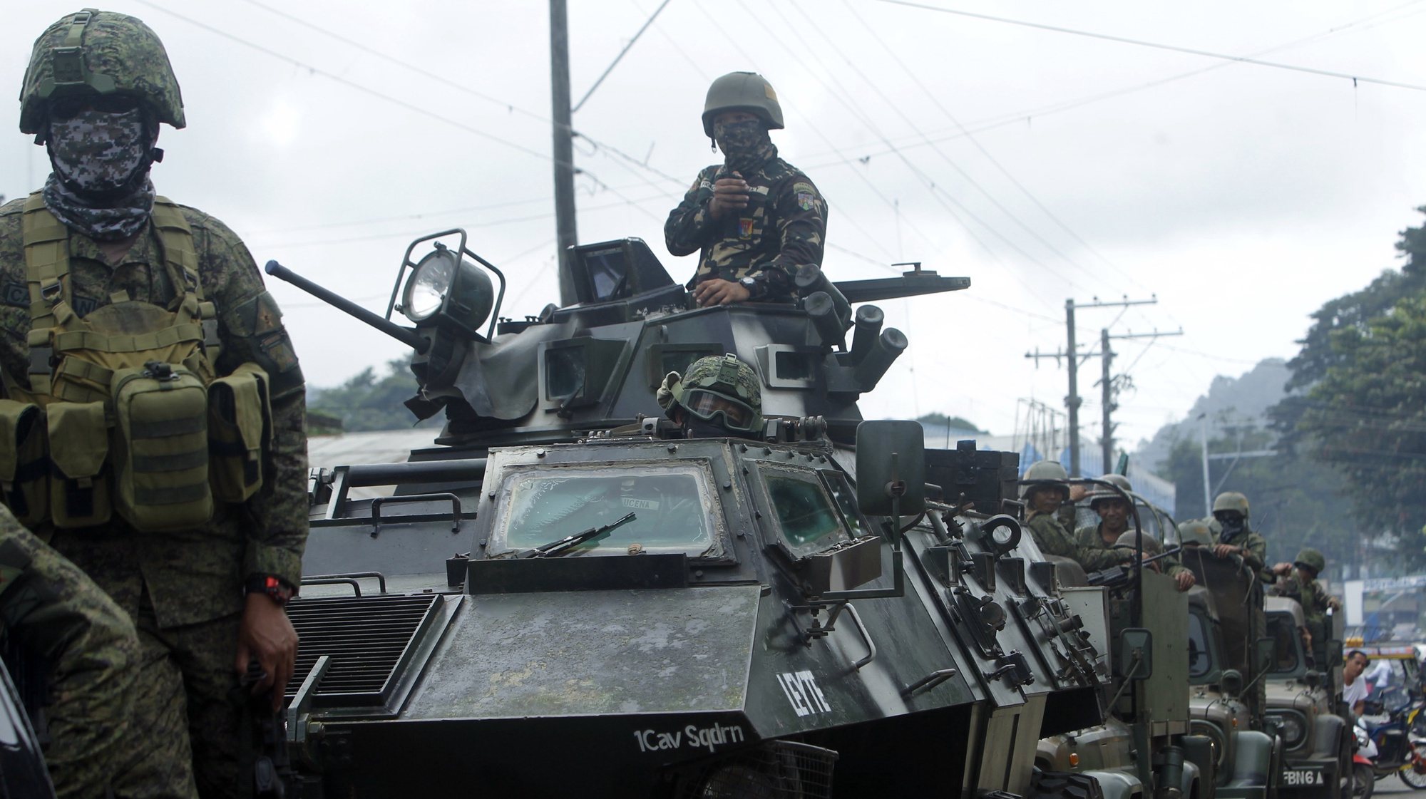 epa07308557 Philippine government troops on armored vehicles conduct a patrol a day after the plebiscite on the Bangsamoro Organic Law (BOL) in Jolo town, in the volatile island of Sulu, southern Philippines, 22 January 2019. On 21 January, over two million Filipinos voted in a referendum to ratify a much-awaited peace agreement with Islamist separatists for creating an autonomous region in restive Mindanao of the Philippines. The plebiscite asked voters if they backed the Bangsamoro Organic Law on creating a self-ruled region to end decades of separatist conflict in the region. The vote follows an agreement between the government and the Moro Islamic Liberation Front that has been fighting for independence in southern Philippines.  EPA/BEN HAJAN