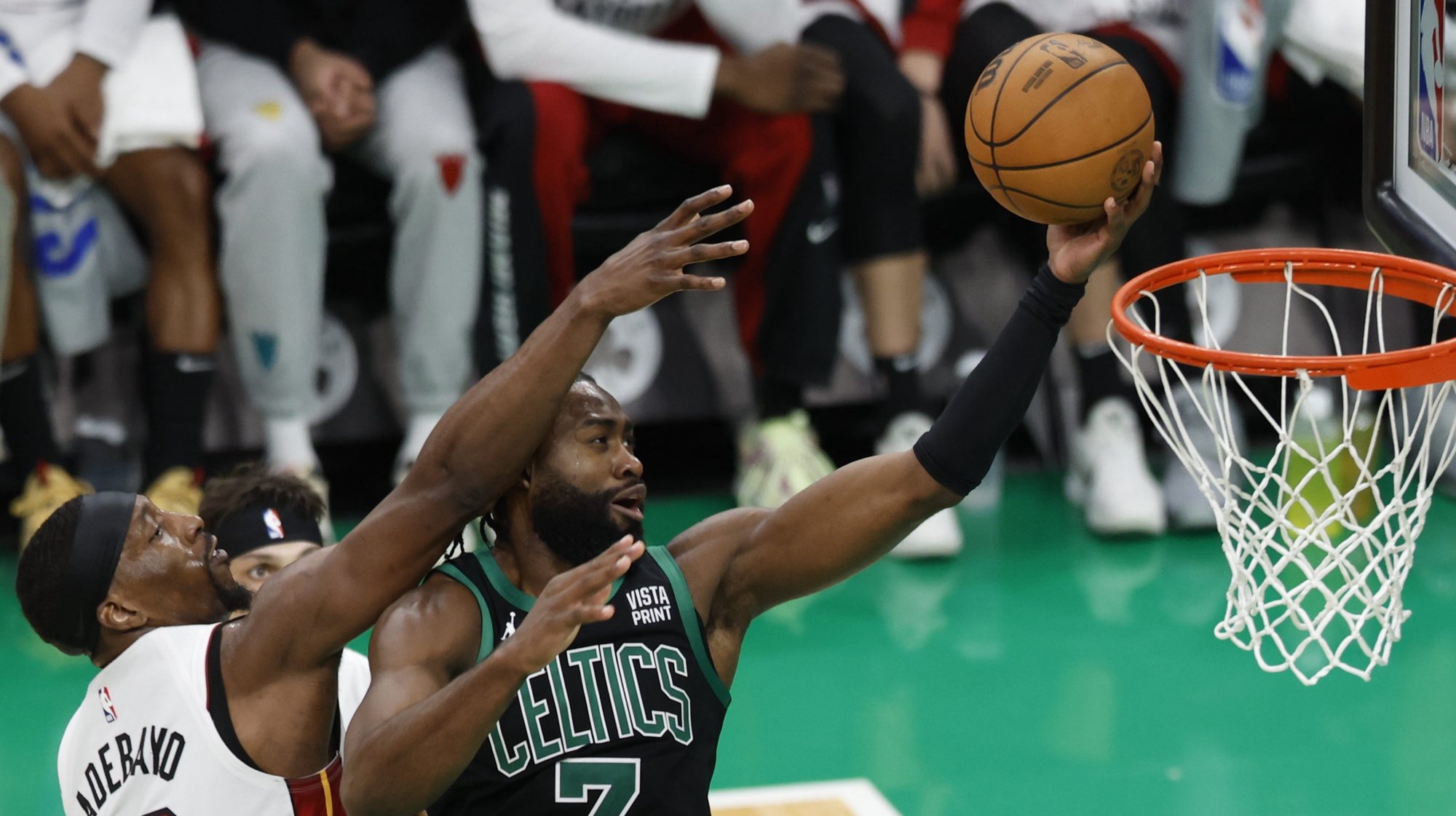epa11313608 Boston Celtics guard Jaylen Brown (R) shoots as Miami Heat center Bam Adebayo (L) defends during the second half of the Eastern Conference first round game five between the Boston Celtics and the Miami Heat in Boston, Massachusetts, USA, 01 May 2024. The Boston Celtics defeated the Miami Heat and advance to the Eastern Conference Semi-finals.  EPA/CJ GUNTHER SHUTTERSTOCK OUT