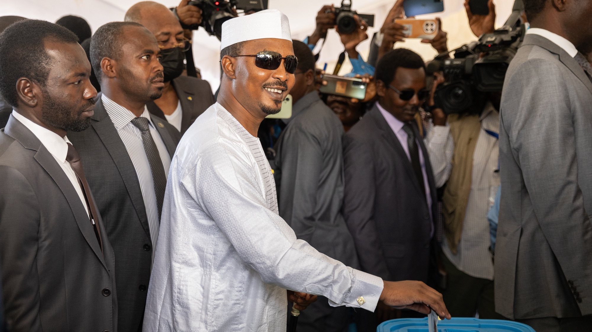 epa11320949 Chadian President Mahamat Idriss Deby (C) casts his vote in the presidential elections in Nâ€™Djamena, Chad, 06 May 2024. Over eight millions citizens in Chad, a landlocked and arid country of 18 million people in Central Africa, are eligible to cast their votes for the presidential elections on 06 May 2024 according the the national agency in charge of elections.  EPA/JEROME FAVRE