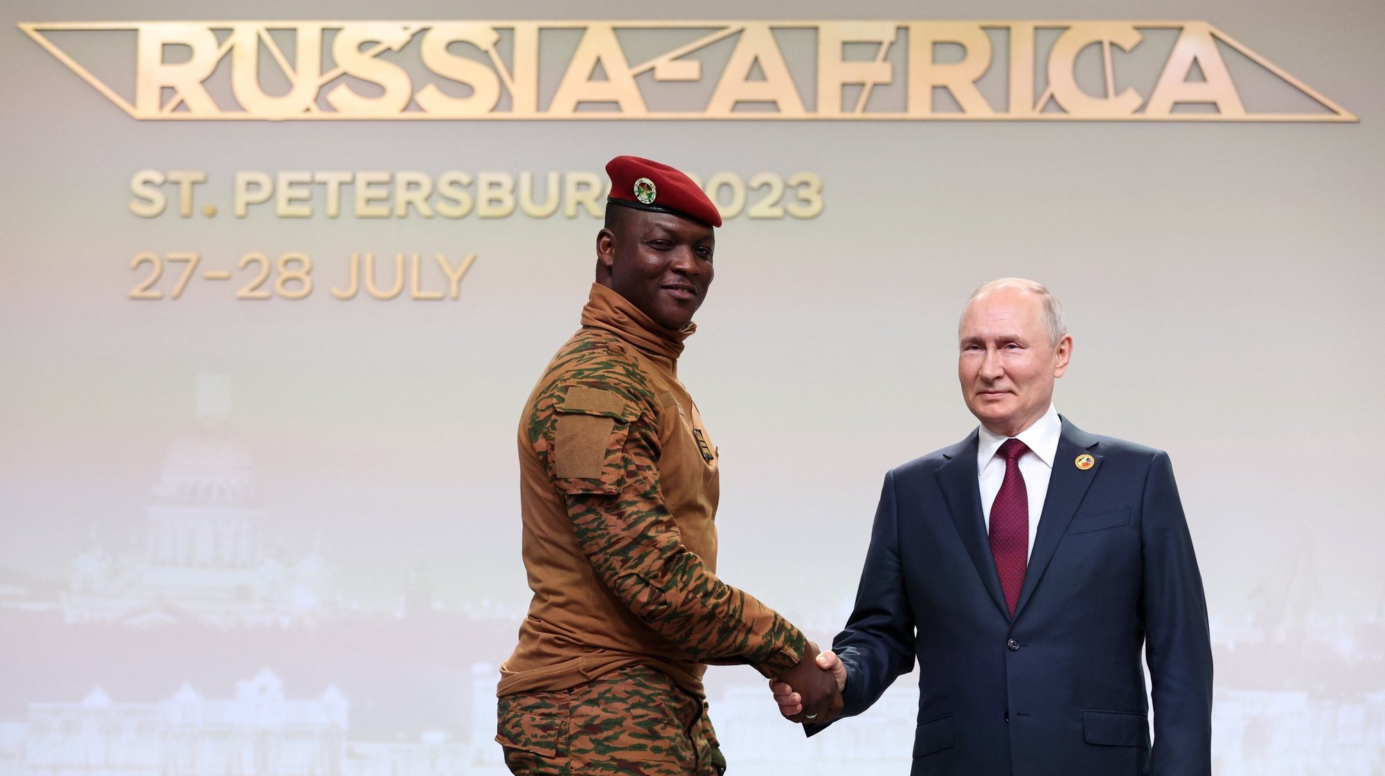 epa10772175 A handout photo made available by TASS Host Photo Agency shows Russian President Vladimir Putin (R) and Burkina Faso President Ibrahim Traore (L), during an official meeting ceremony of the heads of participating delegations of the Second Summit Economic and Humanitarian Forum &#039;Russia-Africa&#039; in St.Petersburg, Russia, 27 July 2023. The Second Summit Economic and Humanitarian Forum &#039;Russia-Africa&#039; will take place from July 27 to 28 at the congress-exhibition center Expoforum in St.Petersburg.  EPA/Sergei Bobylev / TASS Host Photo Agency / HANDOUT MANDATORY CREDIT HANDOUT EDITORIAL USE ONLY/NO SALES
