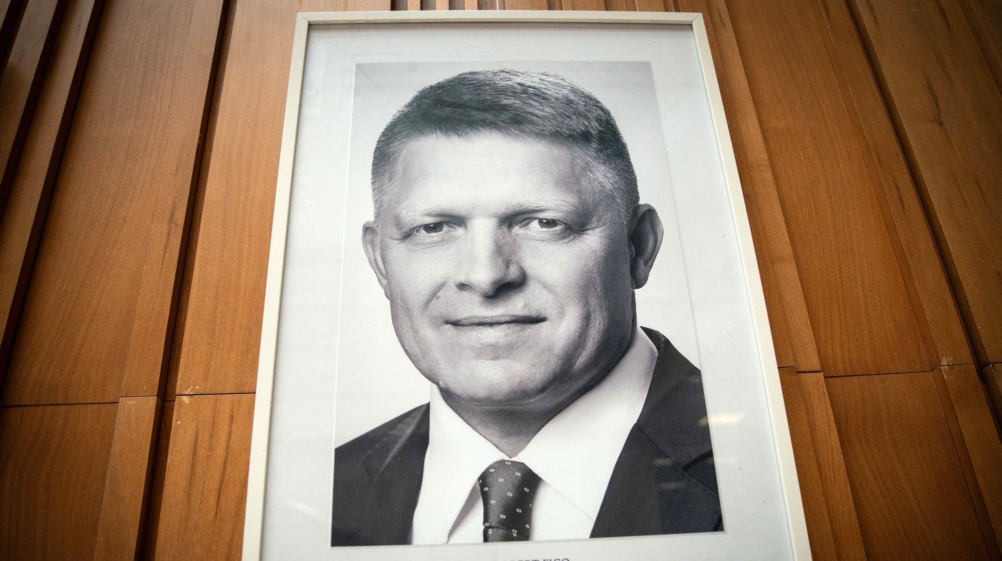 epa11359522 A portrait of Slovak Prime Minister Robert Fico is seen on the wall of the Government Office of the Slovak Republic in Bratislava, Slovakia, 22 May 2024. Slovak Prime Minister Robert Fico was shot and injured in Handlova on 15 May and transported to a hospital in a life-threatening condition; the shooting suspect was arrested on spot.  EPA/JAKUB GAVLAK