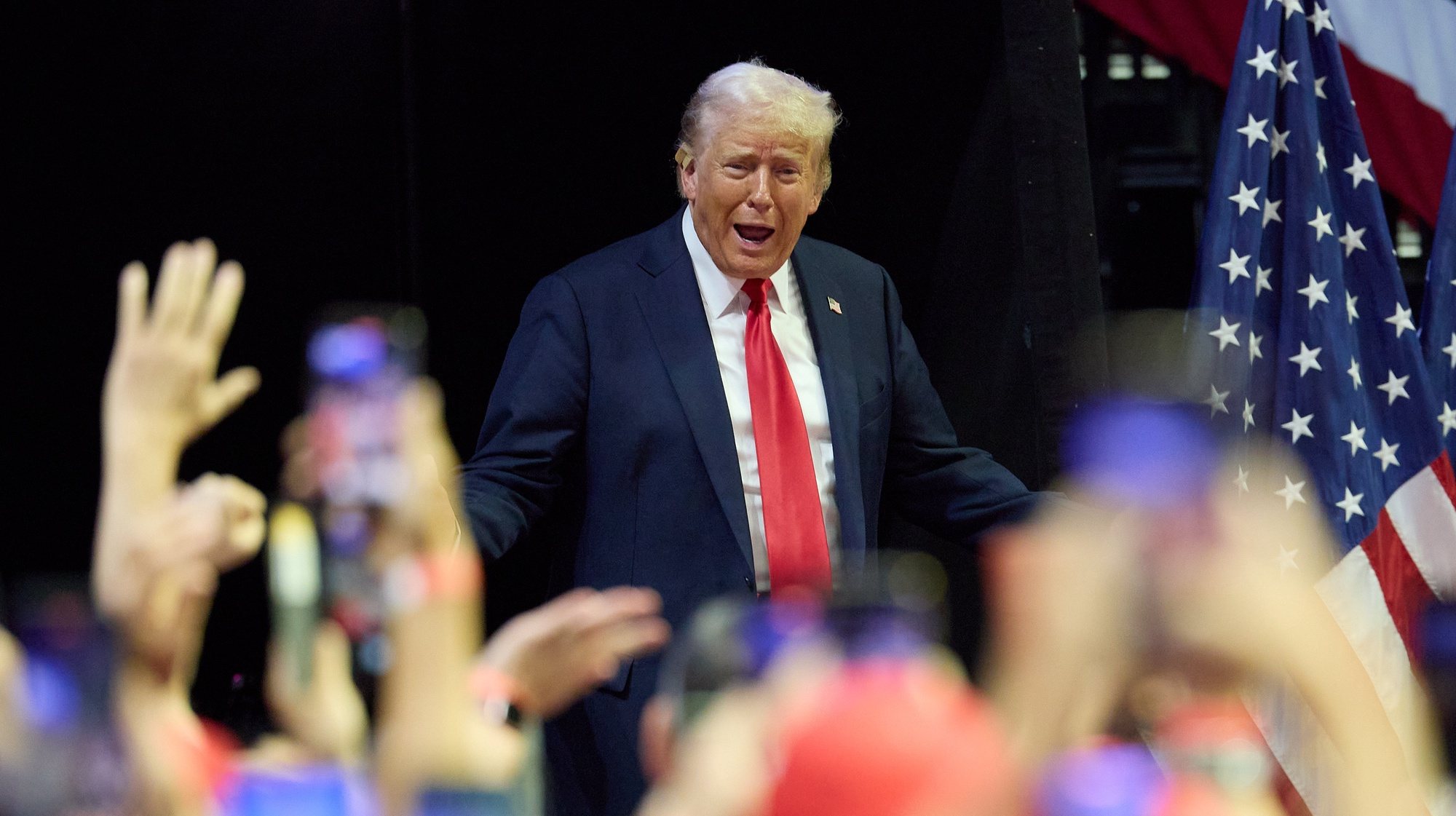 epaselect epa11489801 Republican presidential nominee Donald J. Trump arrives to his first joint rally with Republican vice presidential nominee Senator JD Vance at Van Andel Arena in Grand Rapids, Michigan, USA, 20 July 2024.  EPA/ALLISON DINNER