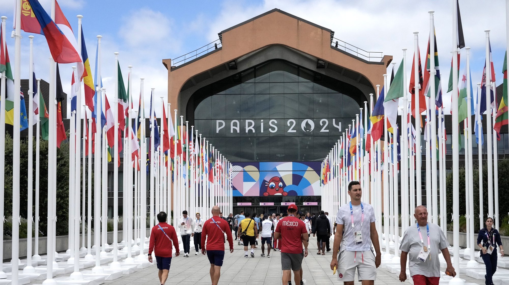 epa11491300 People walk in front of the Olympic village canteen for the Paris 2024 Olympic Games, in Paris, France, 22 July 2024.  EPA/MICHEL EULER / POOL MAXPPP OUT